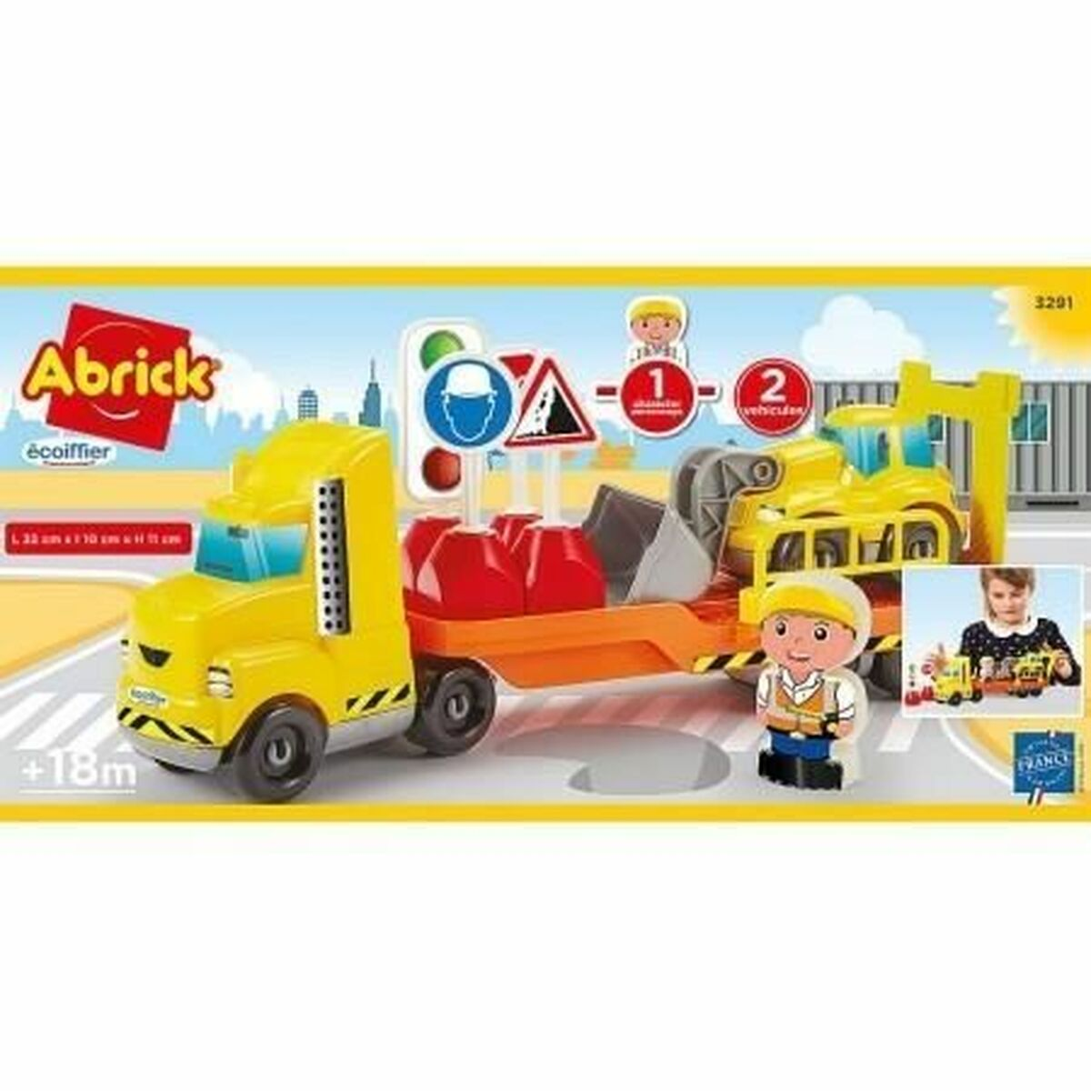 Camion giocattolo giallo con escavatore e segnali di cantiere.