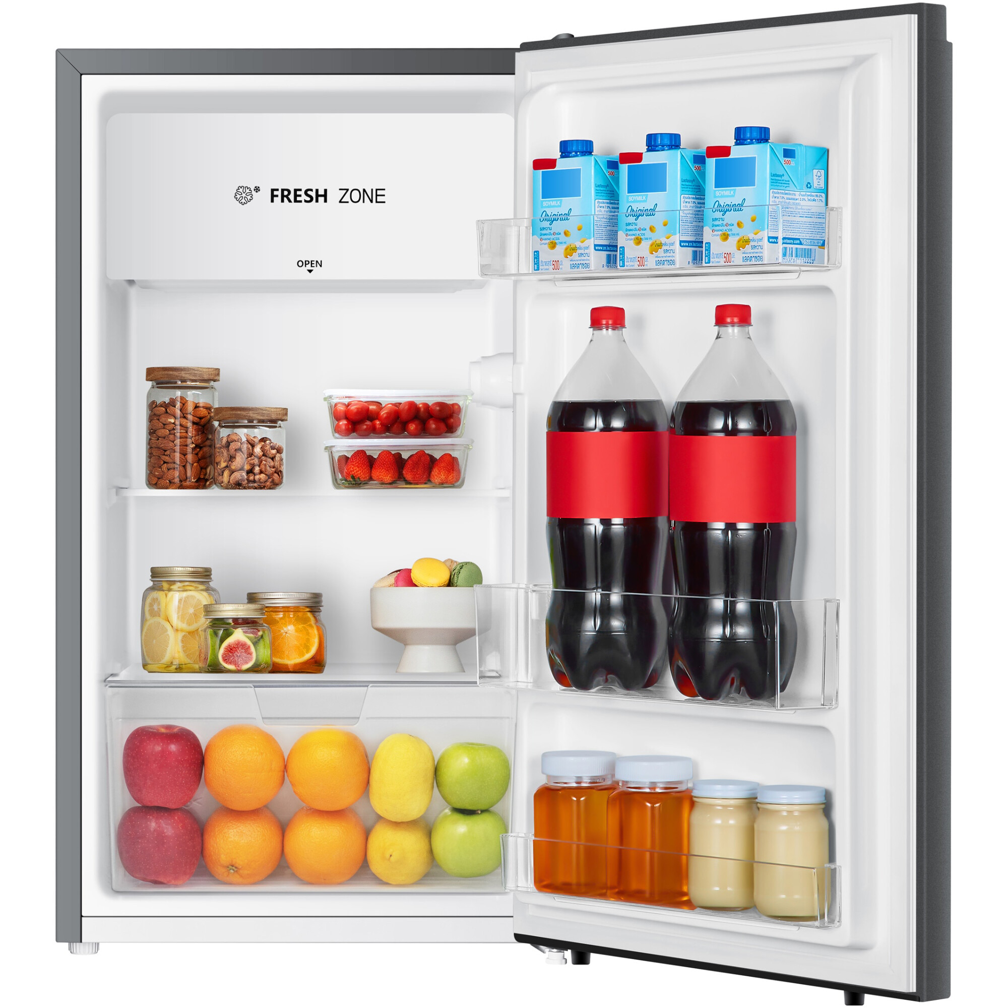 Réfrigérateur ouvert rempli de fruits, boissons, noix et briques de lait de soja.