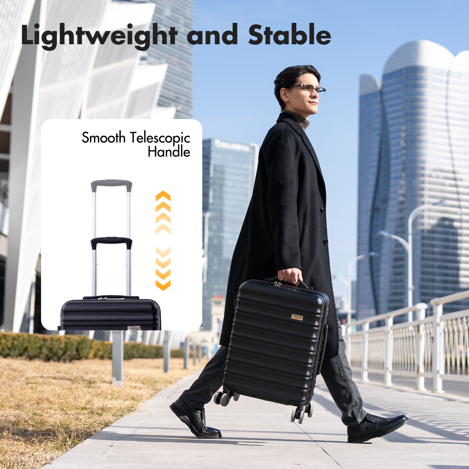 A man with glasses pulls a black suitcase on a sidewalk in front of modern buildings.