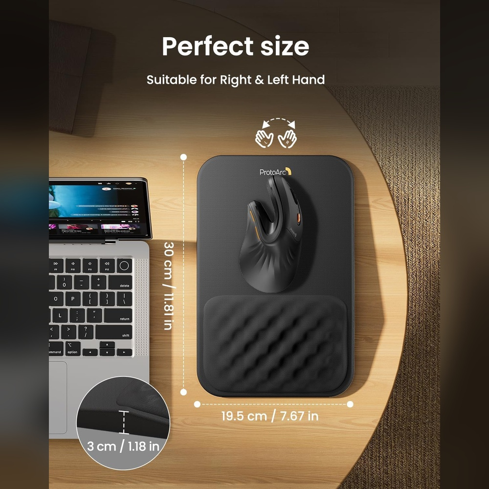 A black mouse and wrist rest on a mousepad, next to a laptop. Dimensions shown.