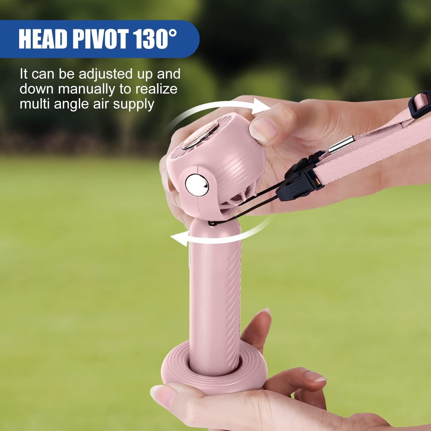 Eine Hand hält einen rosa Ventilator, der manuell um 130° verstellbar ist.