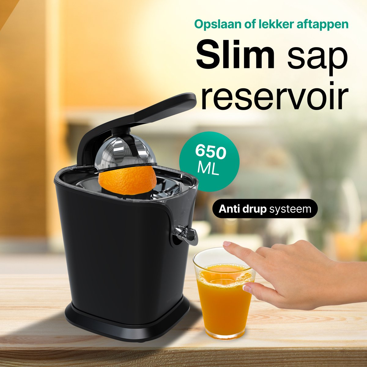 A black juicer with half an orange, 650ml juice in a glass, anti-drip system.