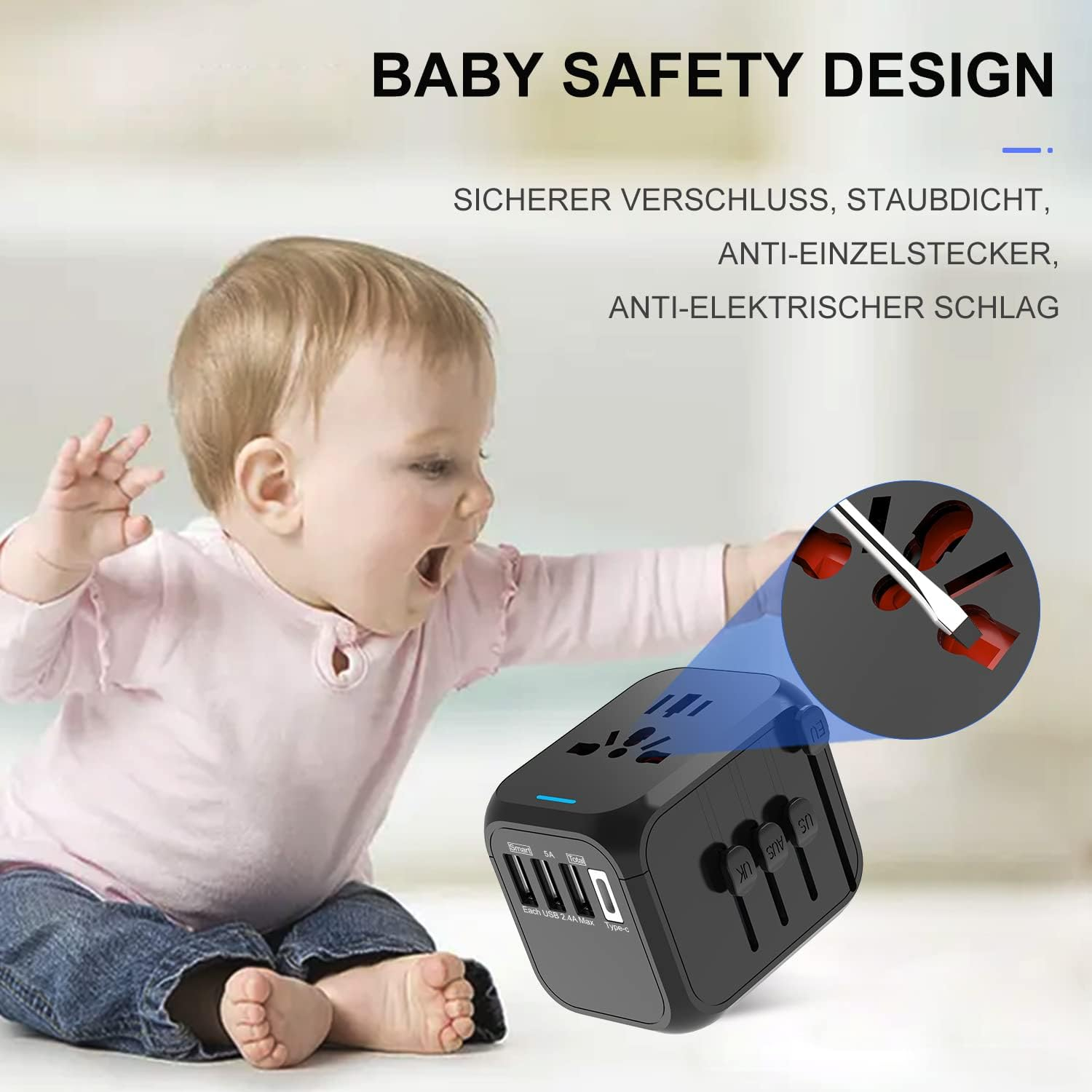 Baby sitzt neben einem schwarzen Reiseadapter mit ausfahrbaren Steckern.