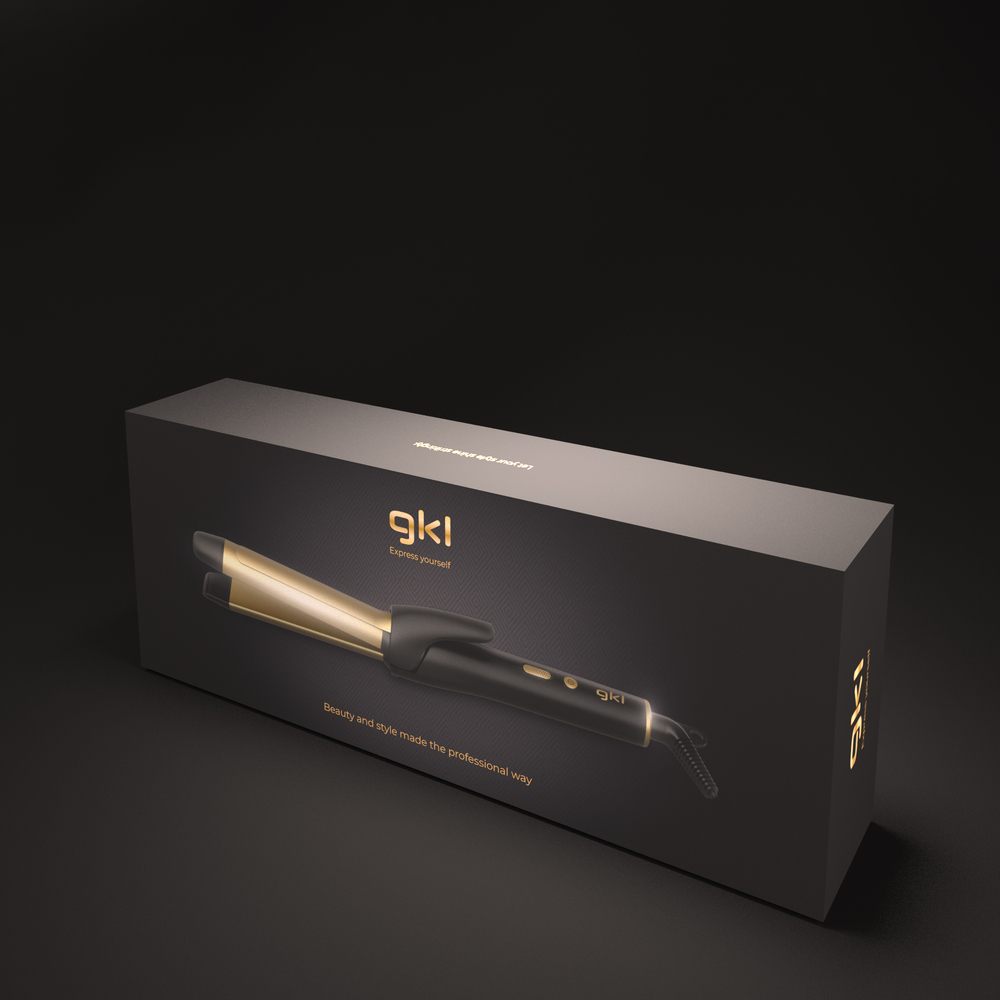 Una caja negra con un rizador dorado y el logo 'gkl'.