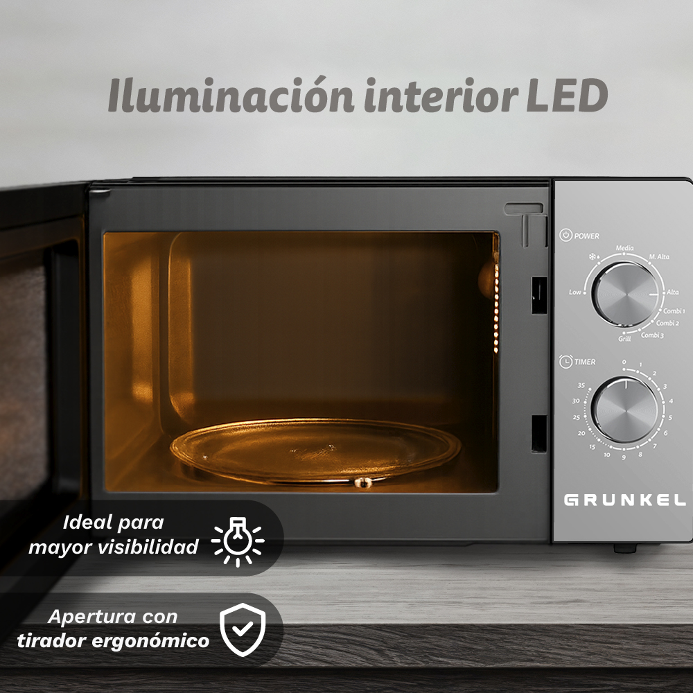 Un moderno forno a microonde con illuminazione interna a LED e due manopole.
