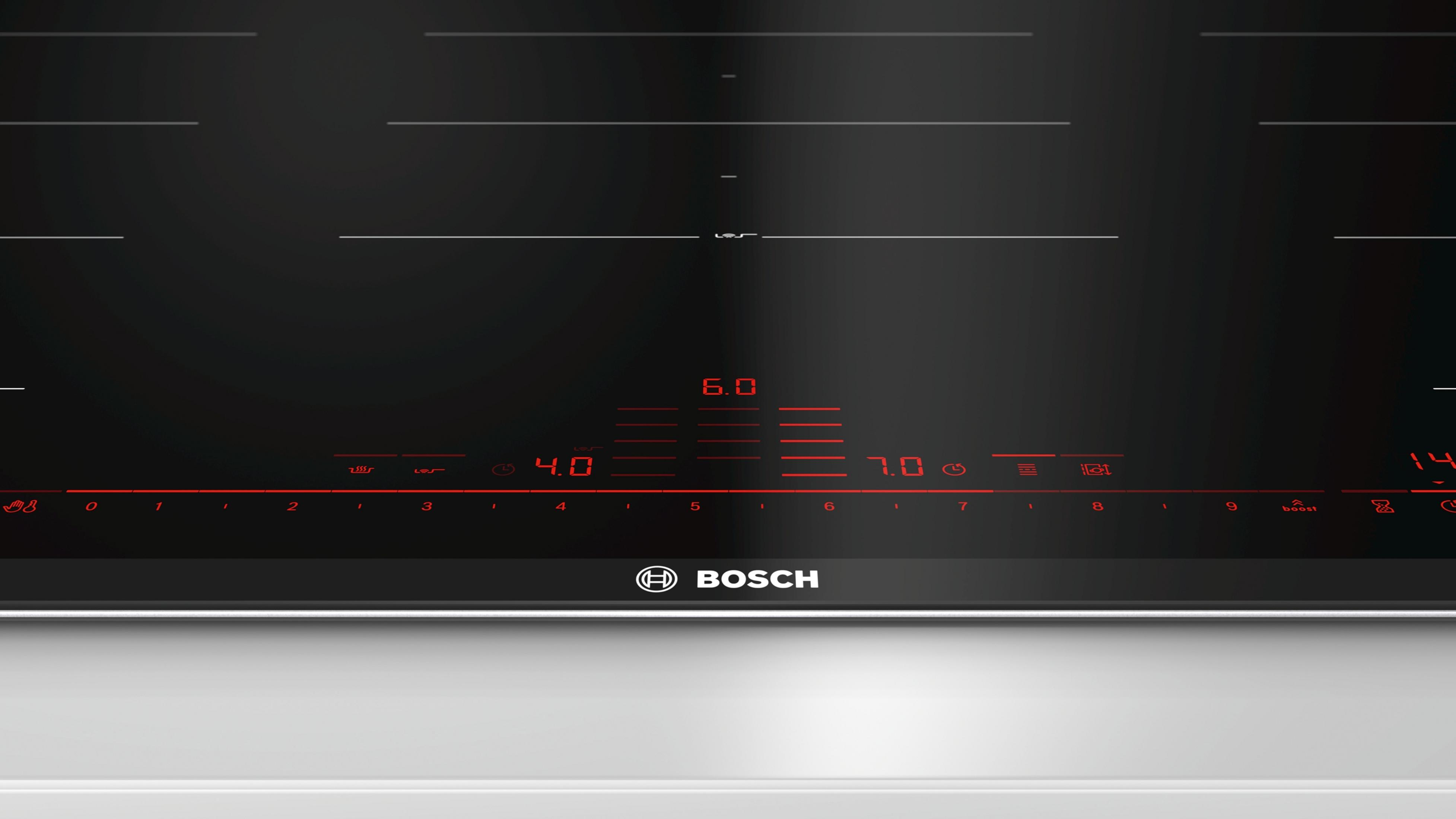 Zwart inductie kookplaat met rode digitale displays voor temperatuur en timer.