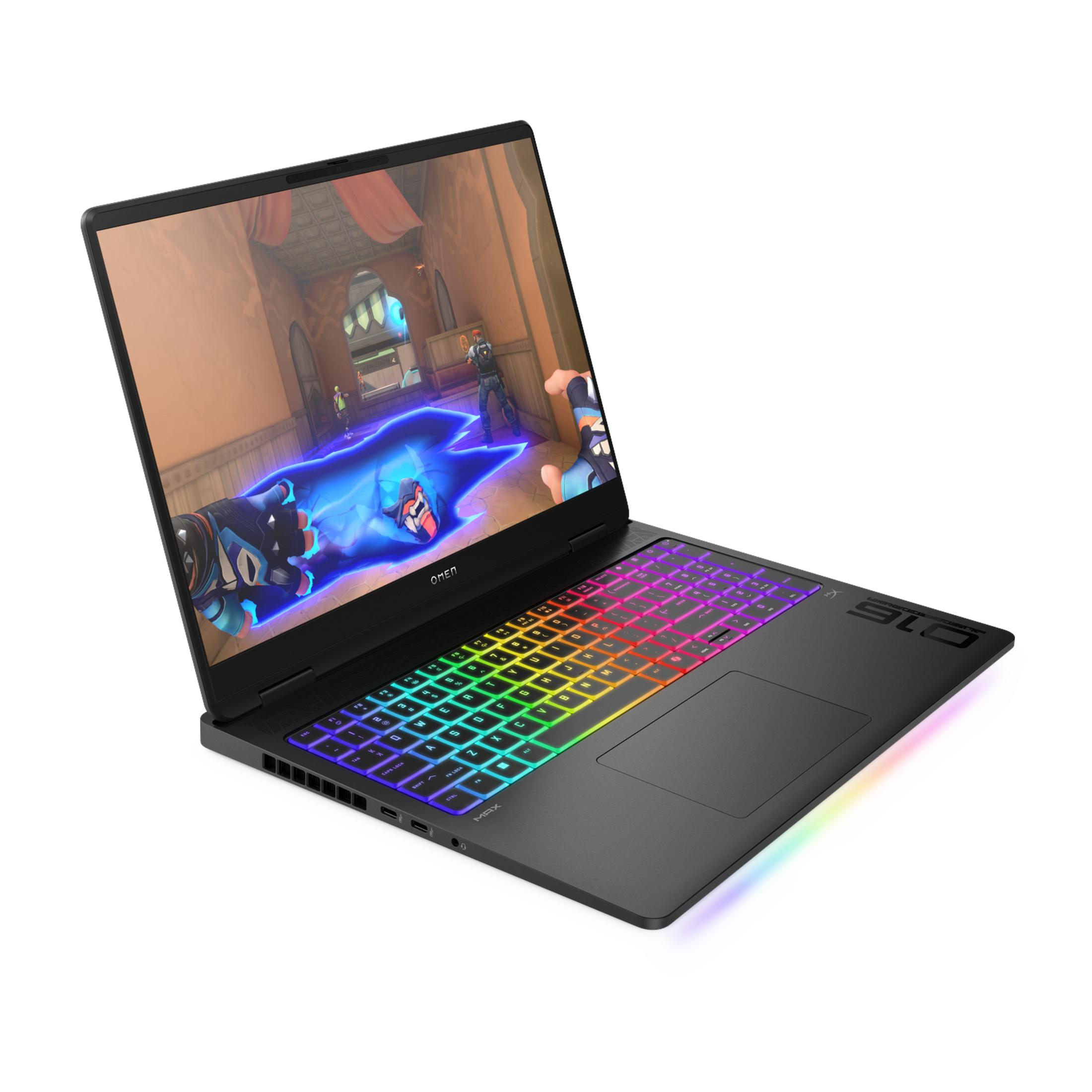 Zwarte laptop met regenboogverlicht toetsenbord en een computerspel op scherm.