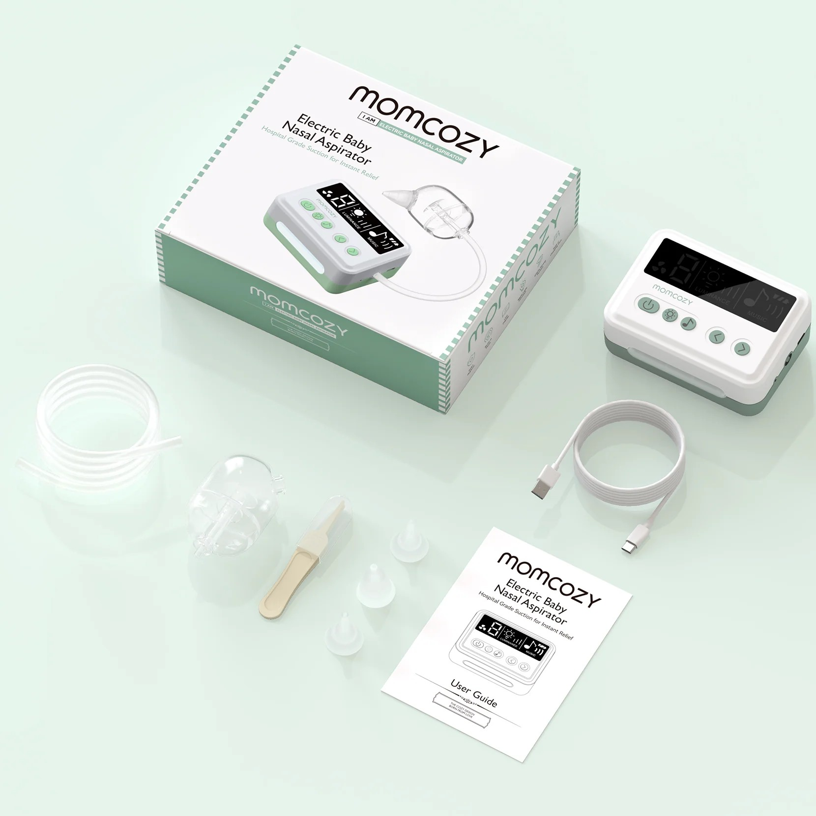 Aspirator do nosa Momcozy: urządzenie, końcówki, kabel i instrukcja na jasnym tle.