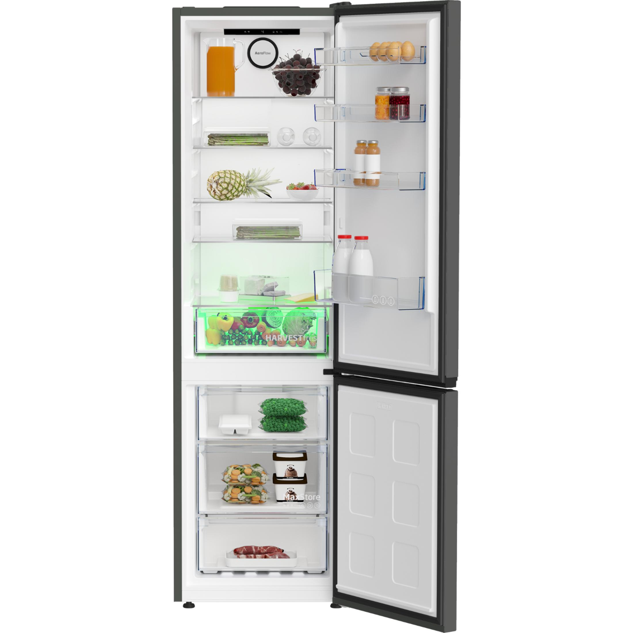 Un refrigerador abierto con jugo, uvas, piña, bayas, verduras y carne.