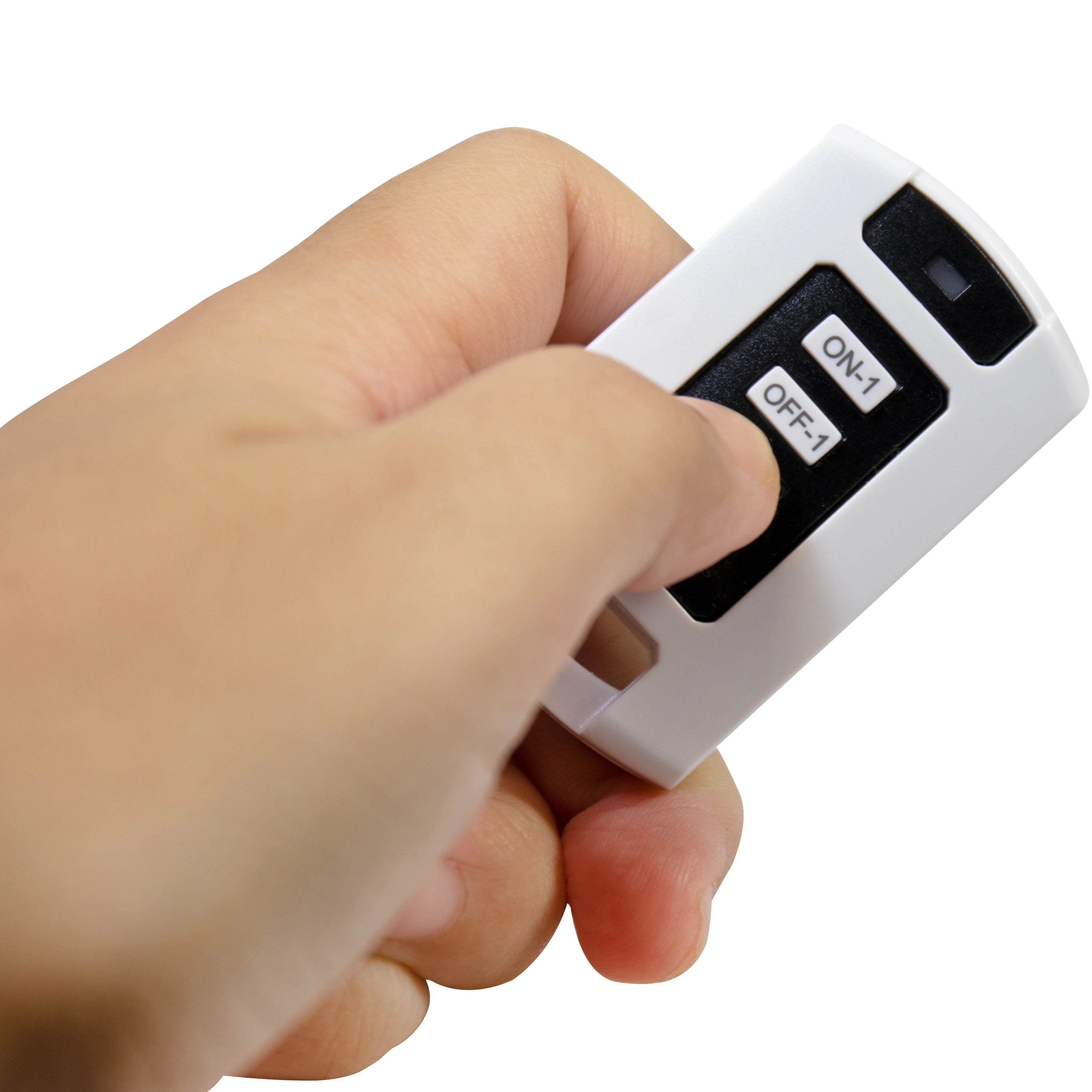 A hand holds a white remote with ON-1 and OFF-1 buttons.