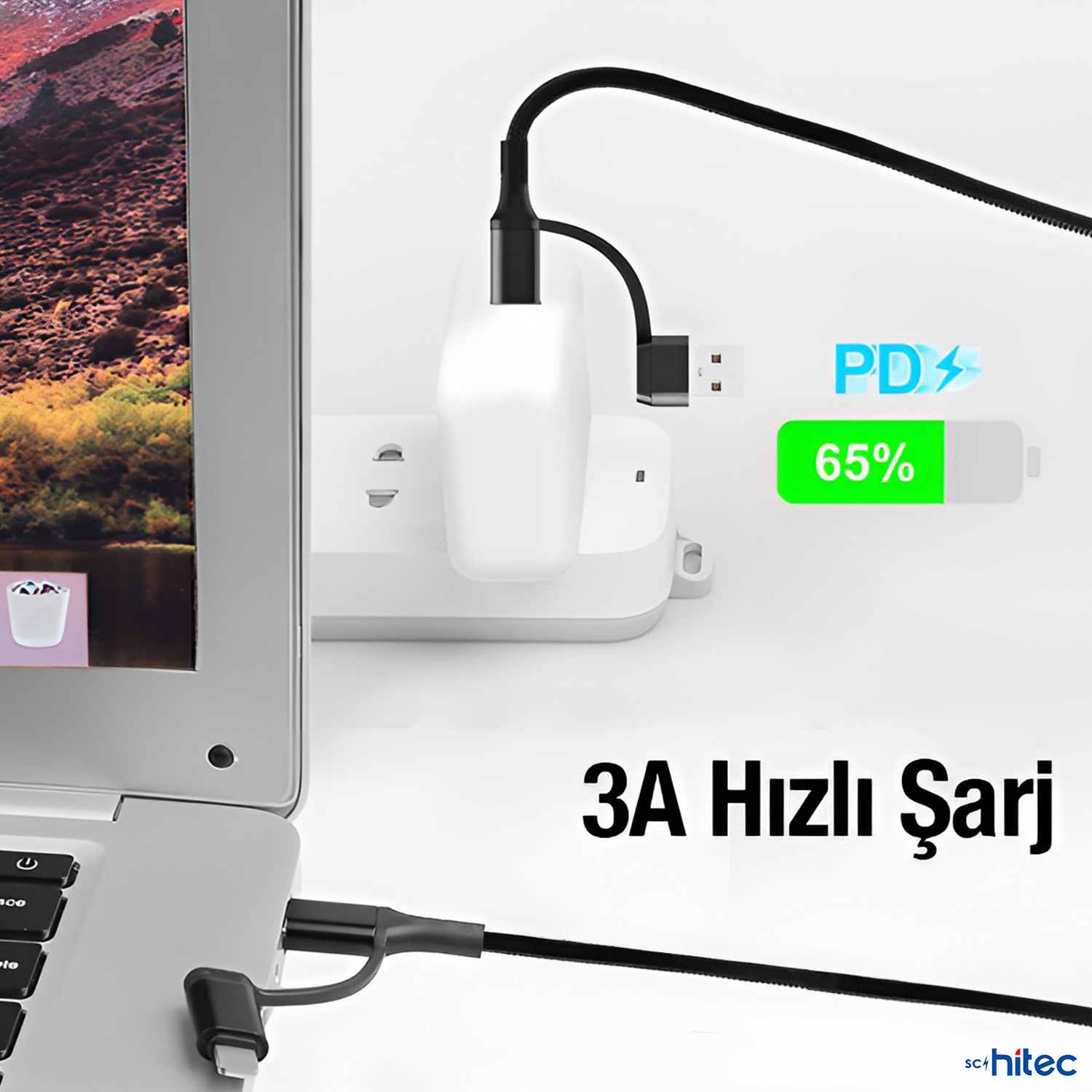 Bir dizüstü bilgisayar, adaptöre ve prize bağlı bir kabloyla şarj oluyor.