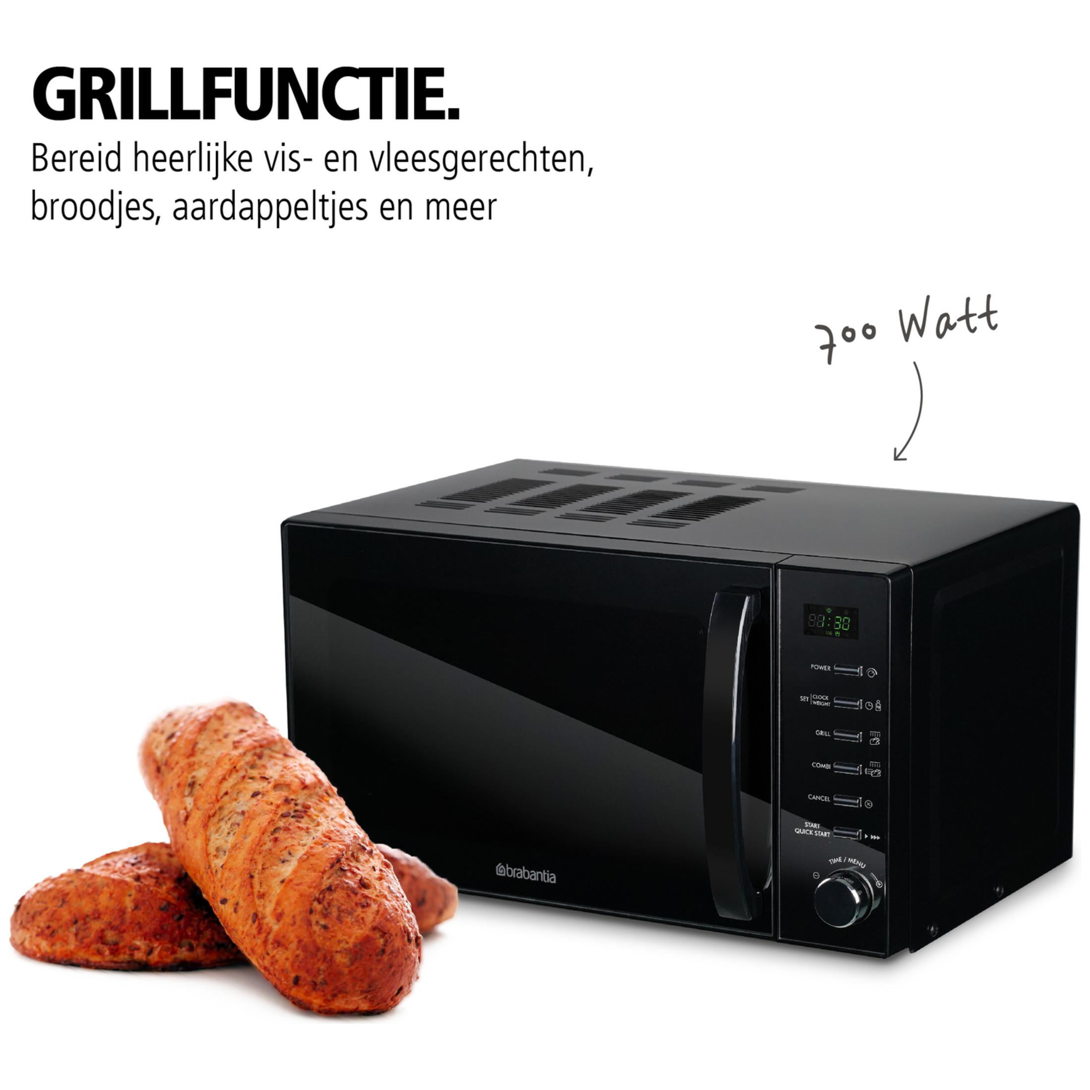 Black 700-watt microwave oven with two loaves of bread.