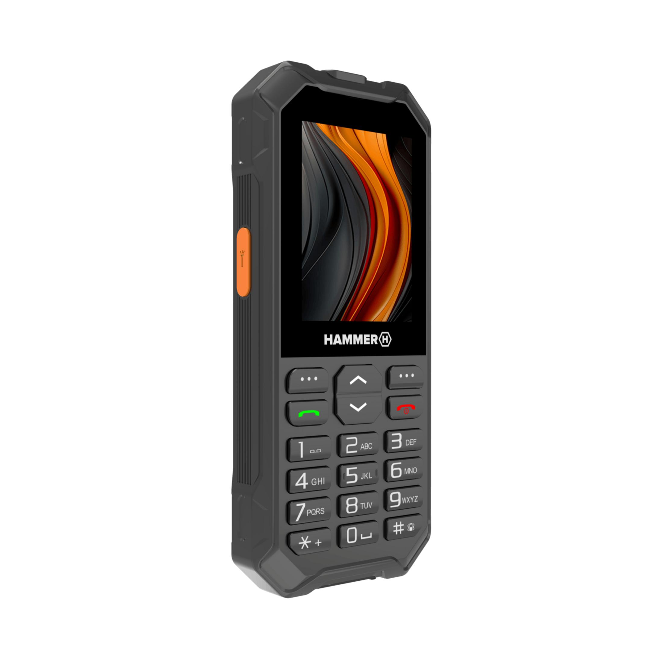 Un teléfono Hammer negro con acento naranja y teclado. Pantalla muestra diseño abstracto.