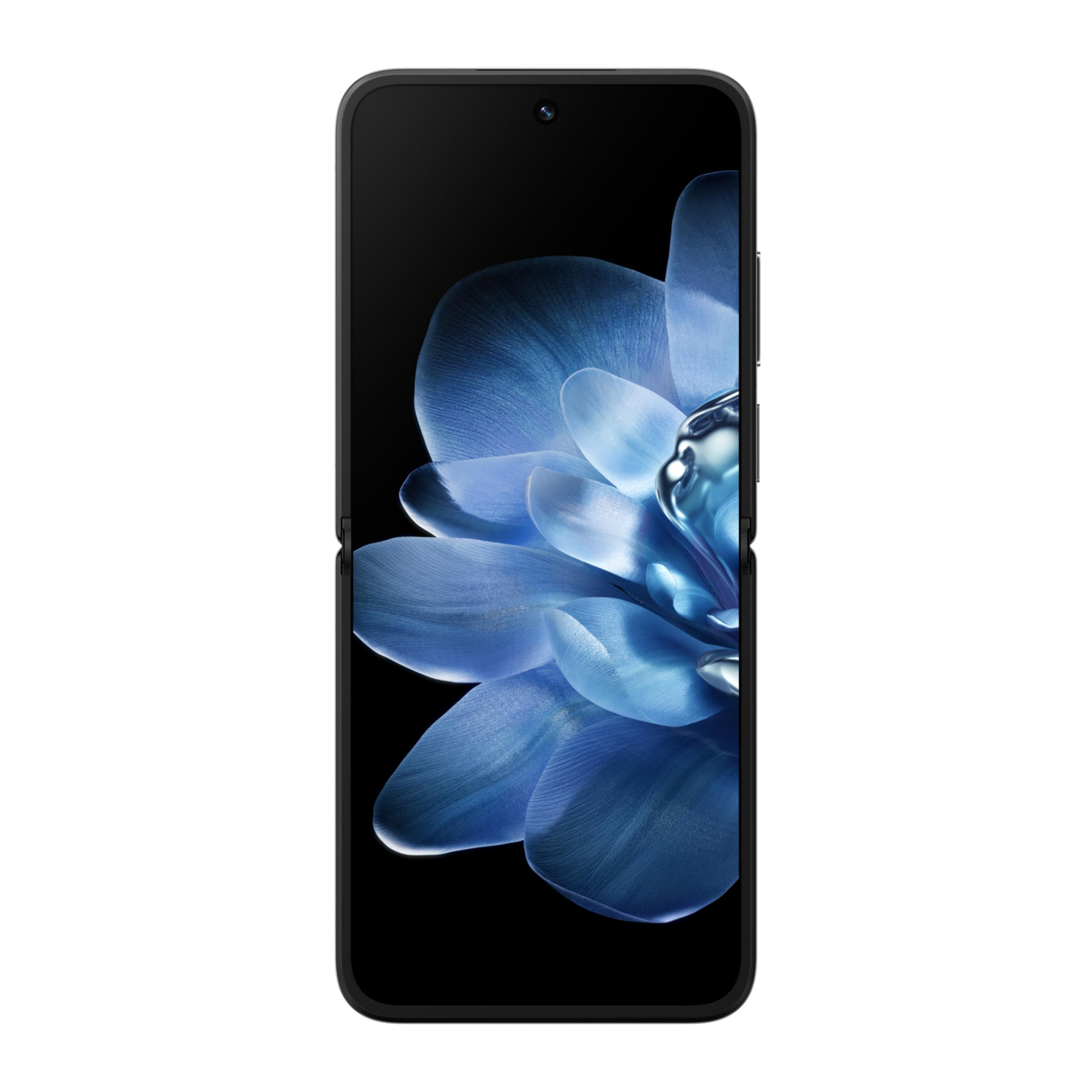 Zamknięty smartfon z tapetą z niebieskim kwiatem na ekranie, pokazany od przodu.