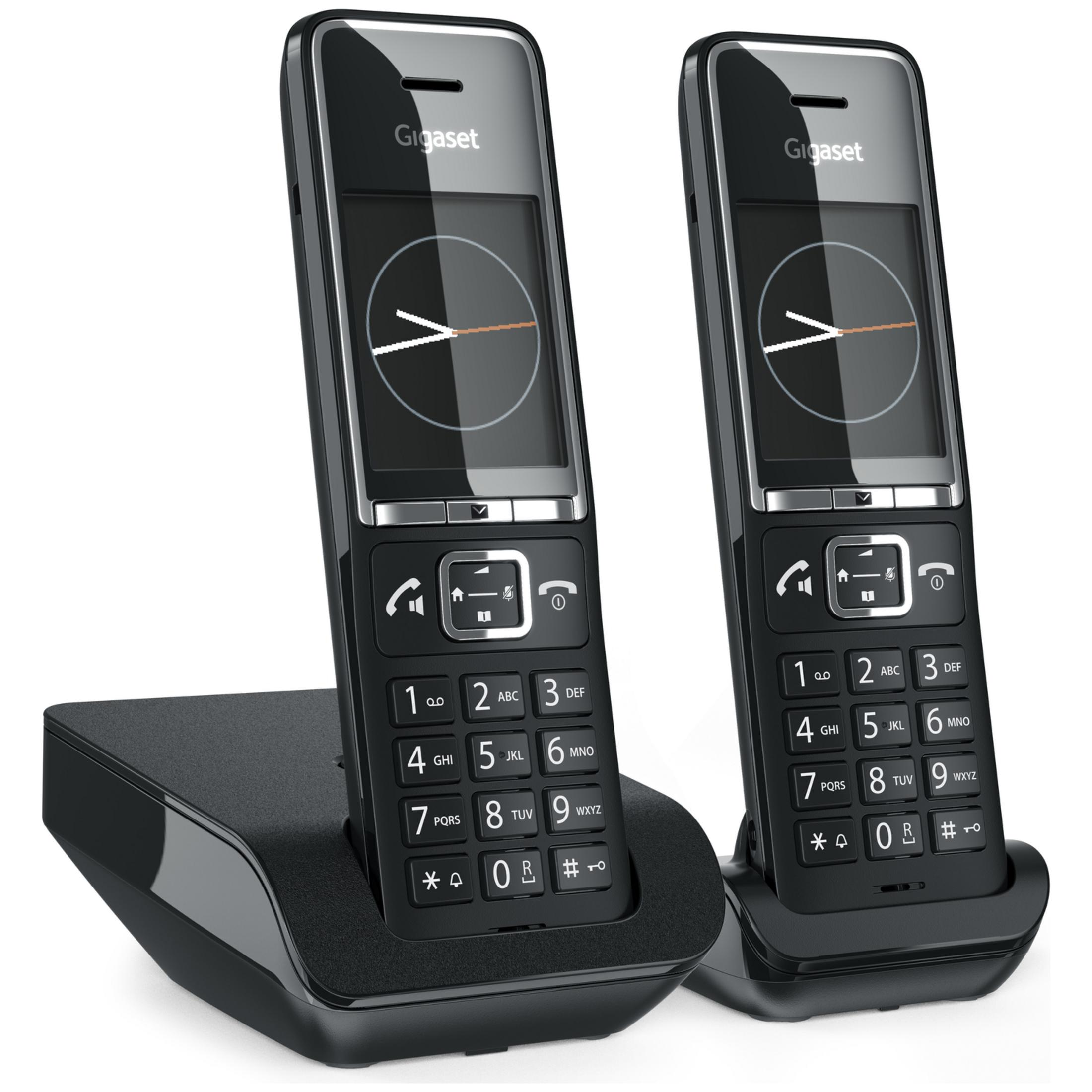 Deux téléphones sans fil Gigaset noirs sont dans leur base de chargement.