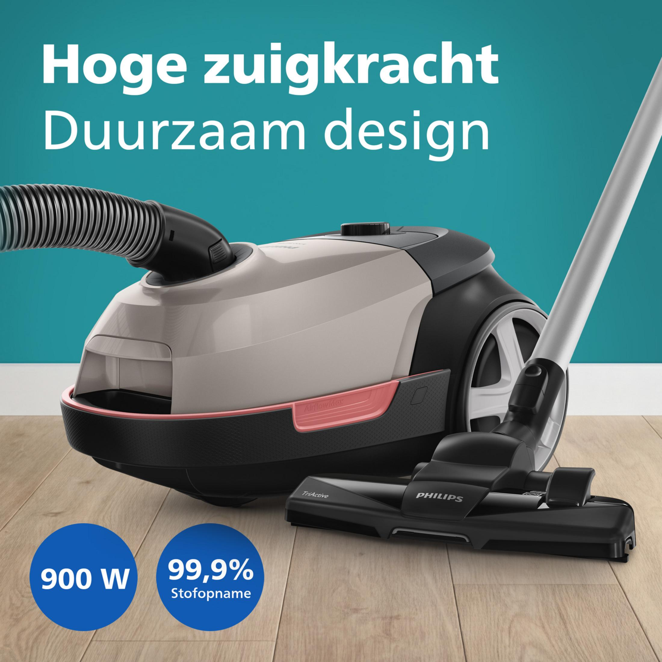 Nowoczesny odkurzacz Philips z wężem i szczotką na drewnianej podłodze.
