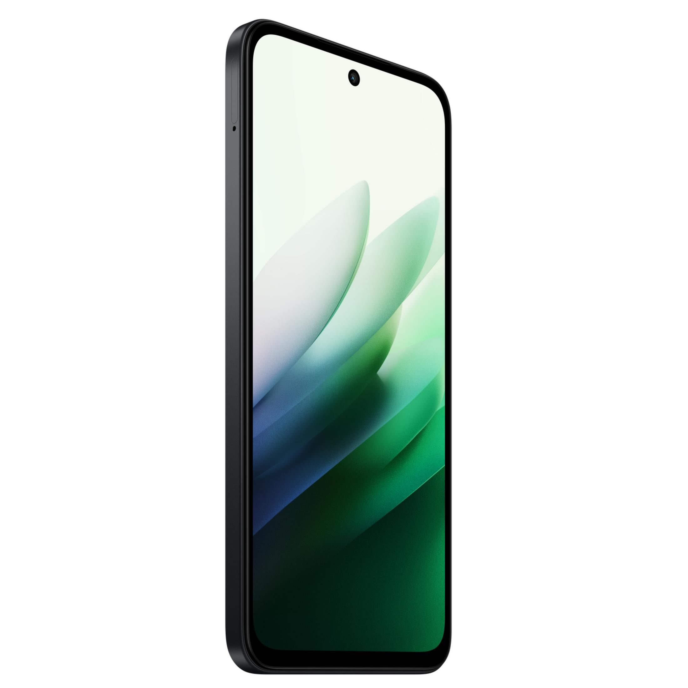 Un smartphone negro muestra un fondo de pantalla verde claro con un patrón ondulado.