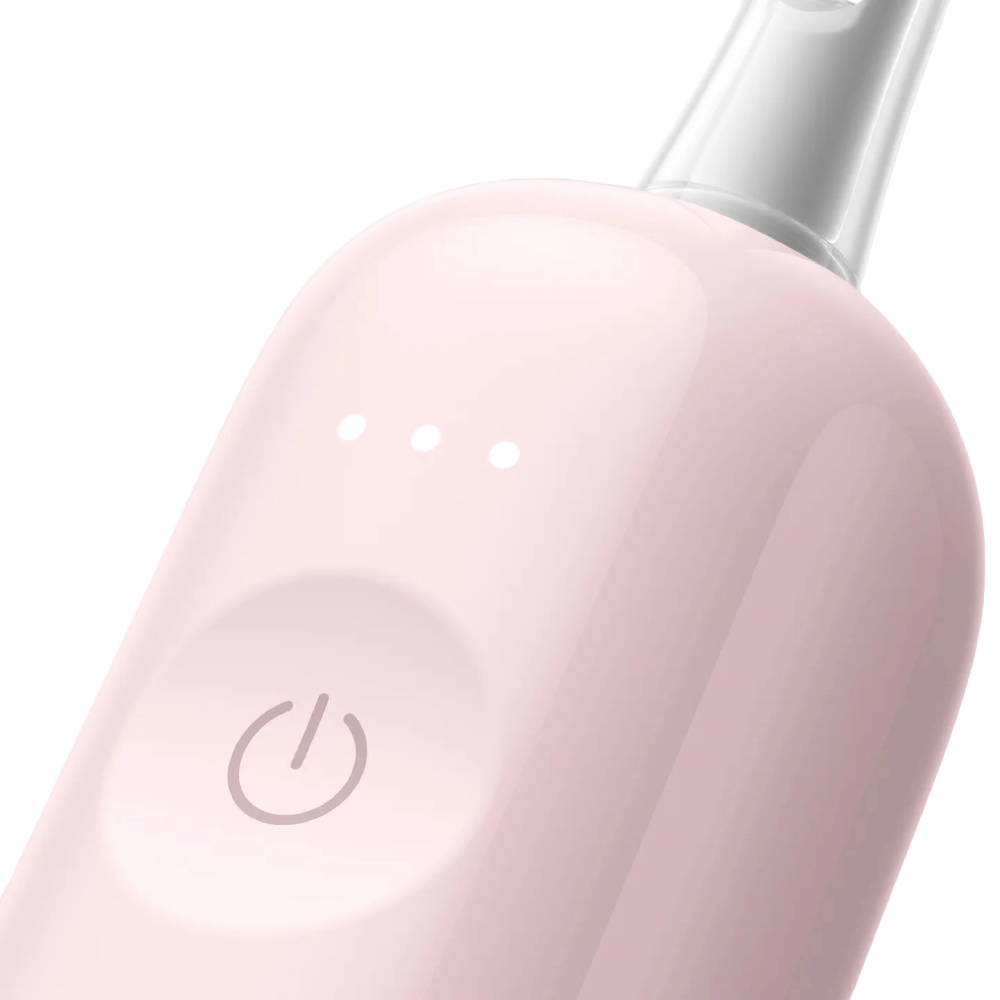 Nahaufnahme eines rosa elektrischen Zahnbürstenkopfes mit Ein-/Aus-Taste.