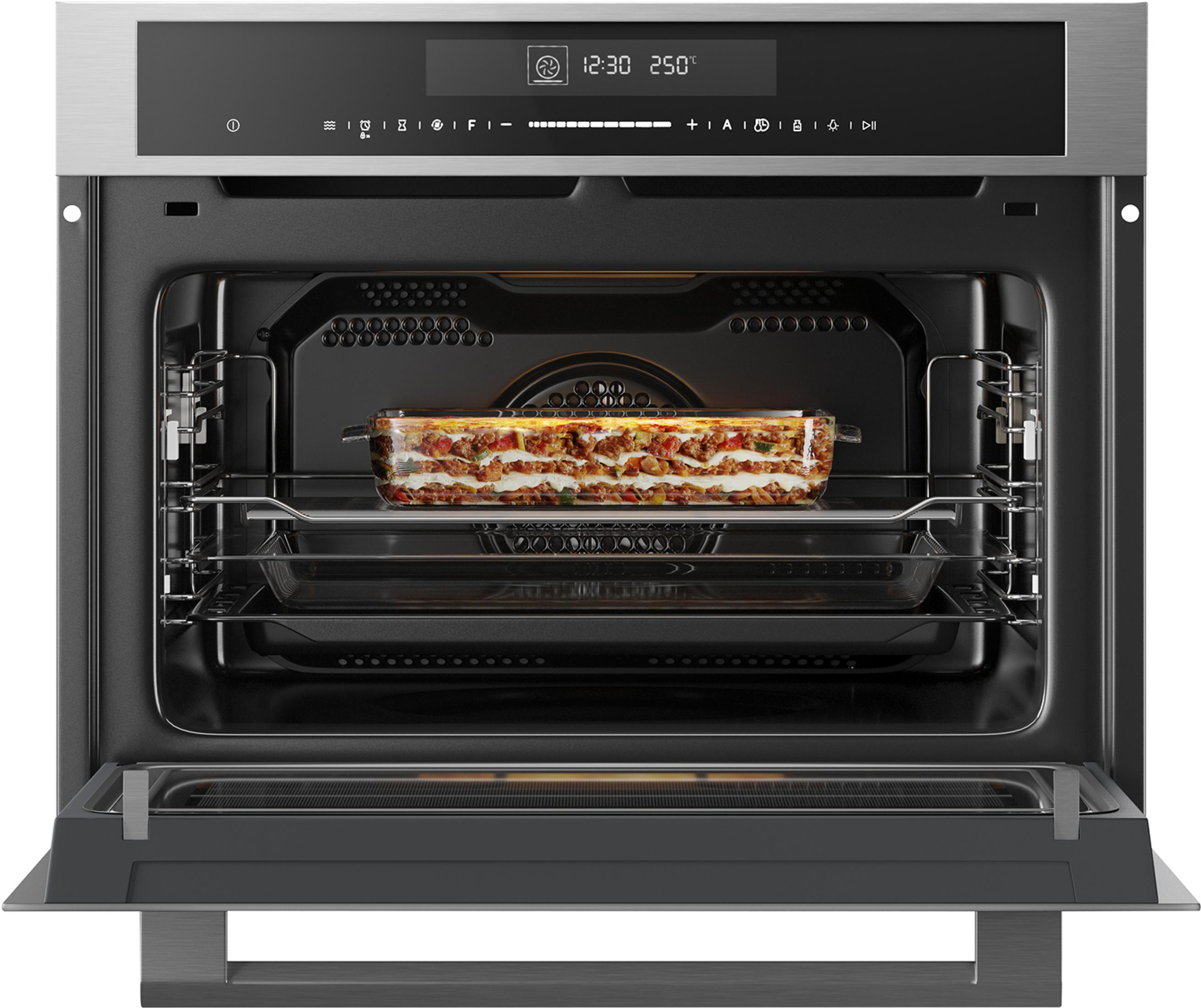 An open built-in oven with a lasagna on the rack.