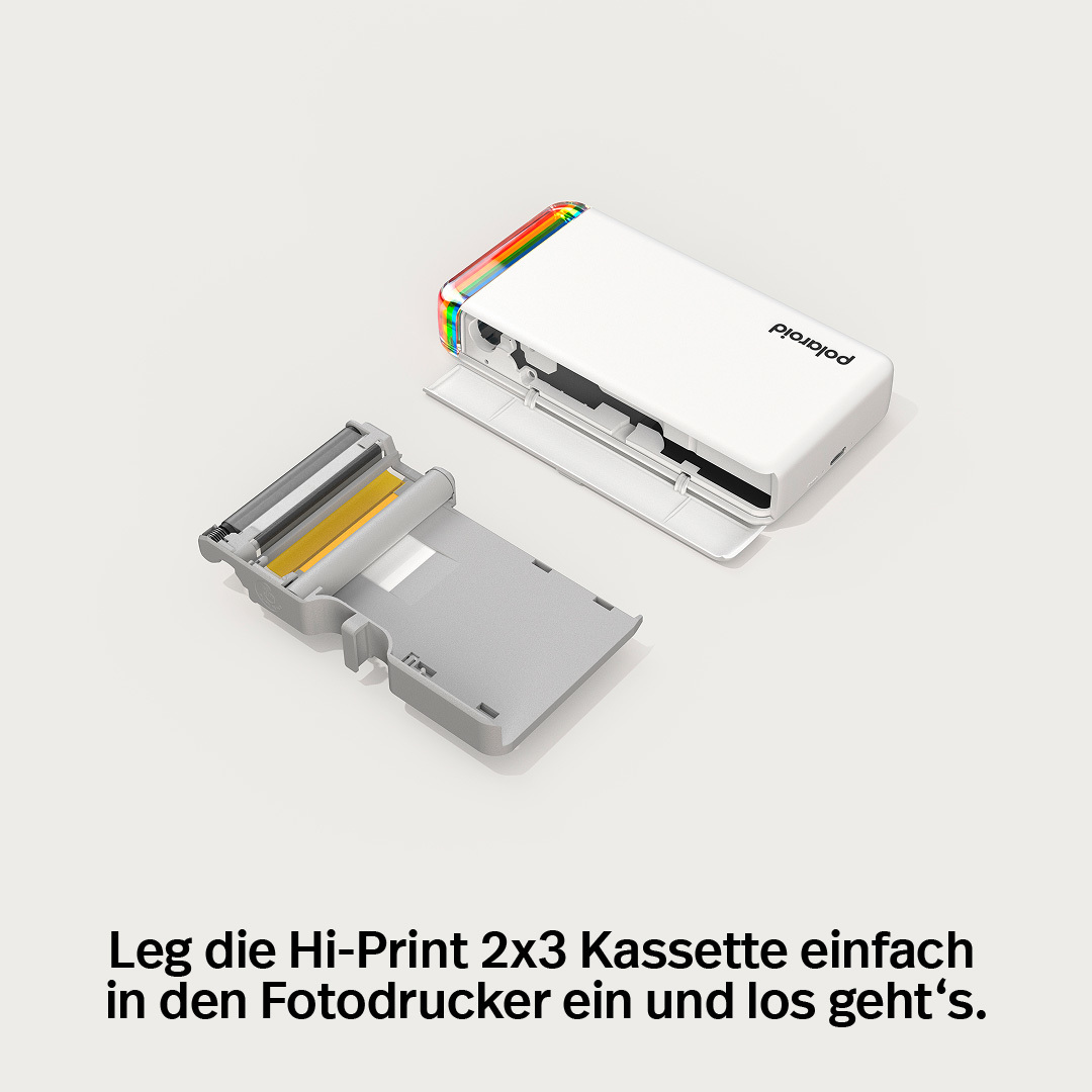 Biała drukarka fotograficzna Polaroid z tęczowymi diodami LED i wysuniętą kasetą.