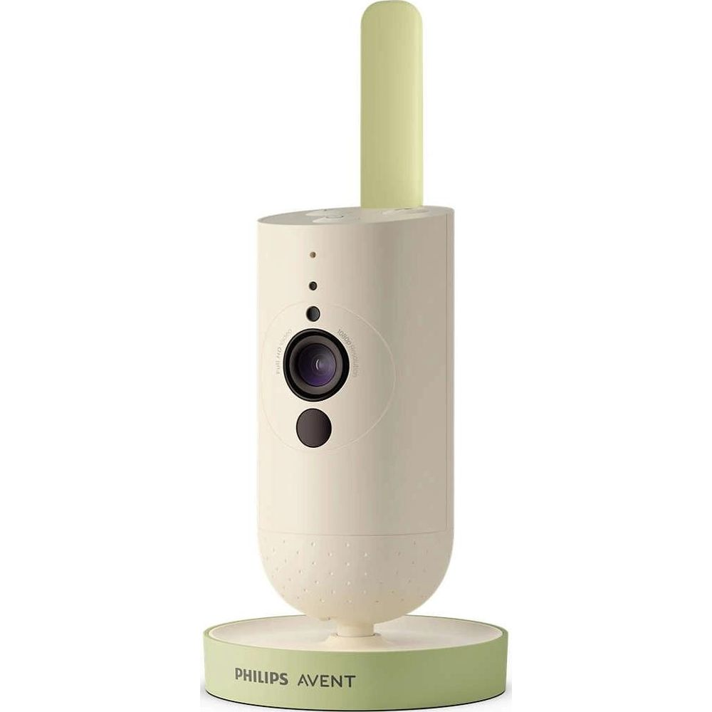 Ein weißer Baby Monitor mit Kamera und grüner Antenne auf einem grünen Sockel.