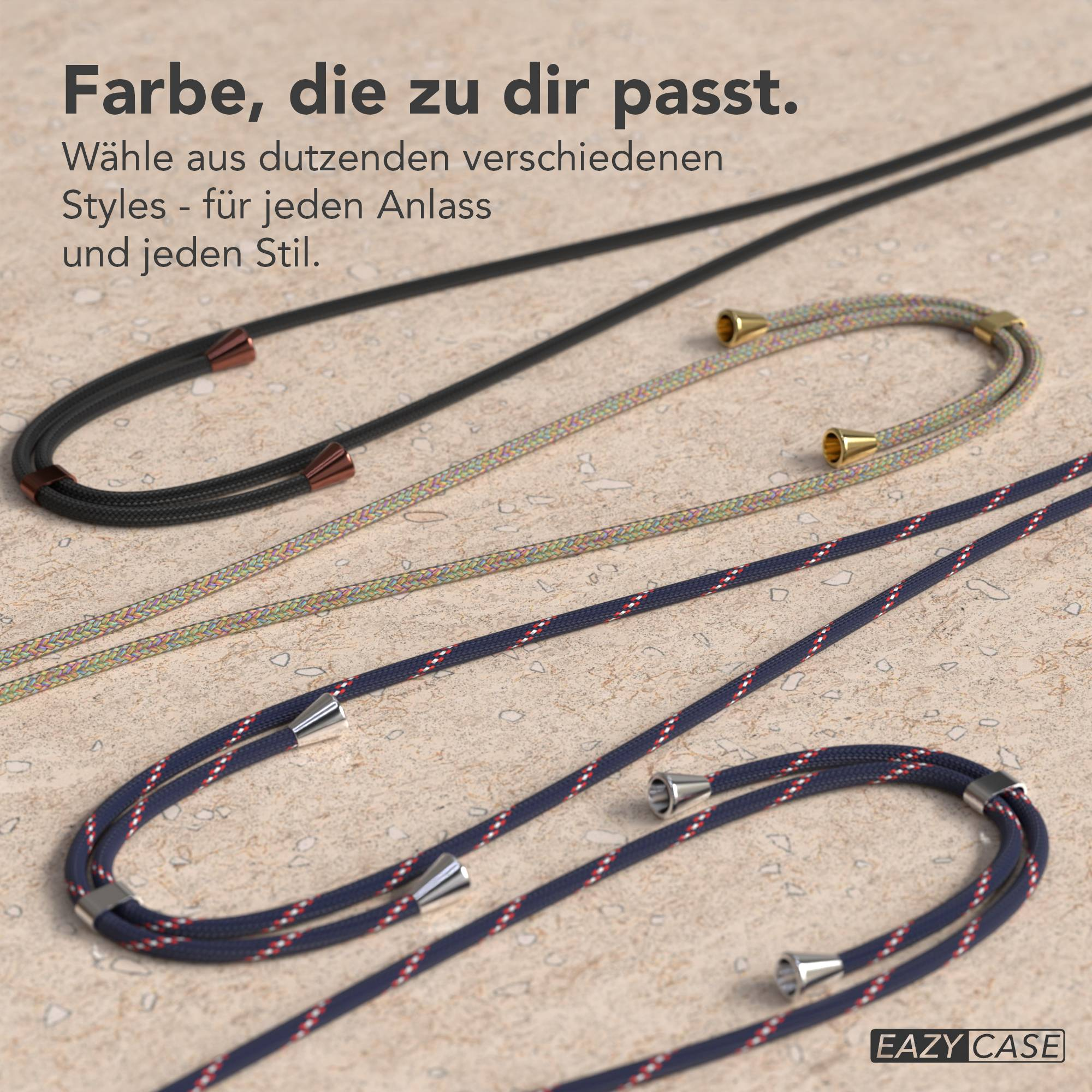 Drei farbige Kordeln mit Metallenden liegen auf einer strukturierten Fläche.