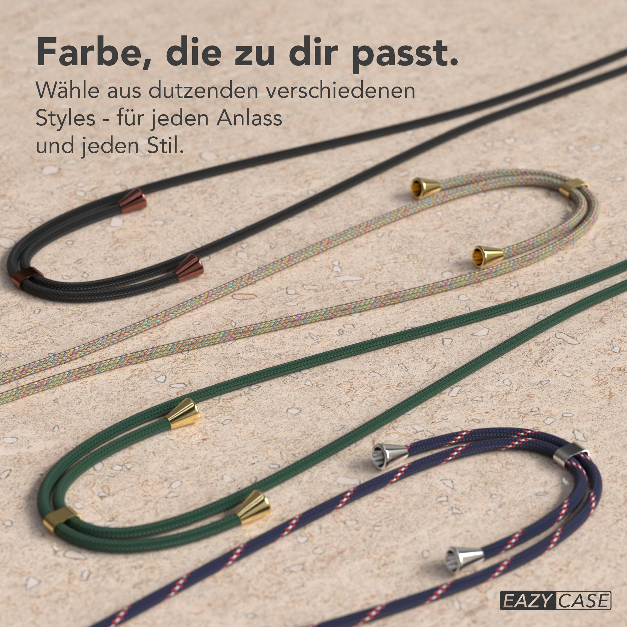 Drei Kordeln für Handyhüllen in Schwarz, Bunt und Grün mit Metallenden auf steinartigem Untergrund.