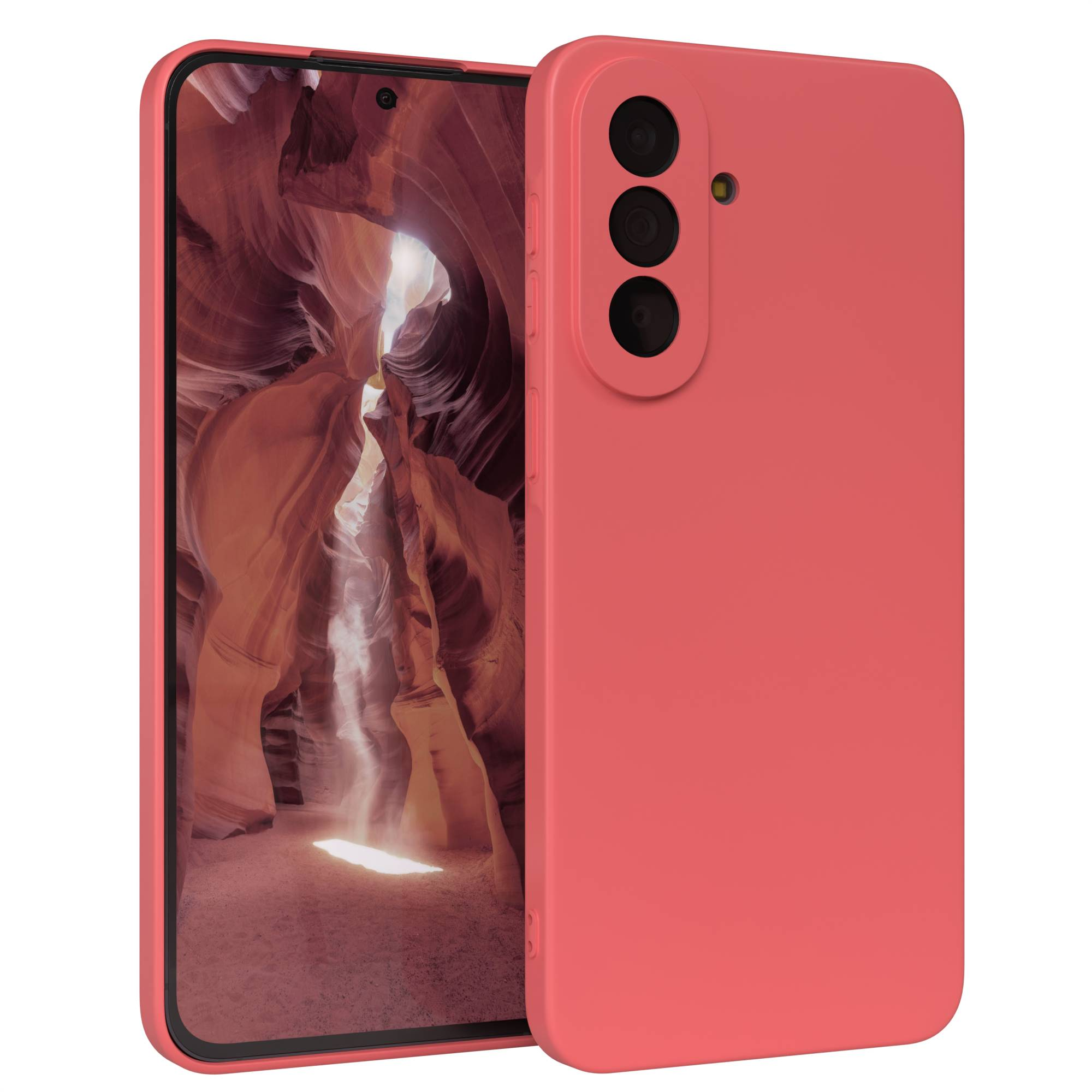 Ein Korallenfarbenes Smartphone mit drei Kameras und einem Bild einer Schlucht auf dem Bildschirm.
