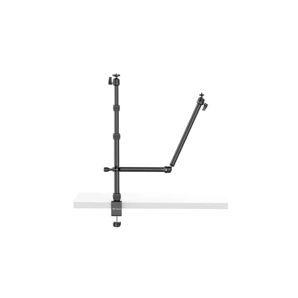 A black C-clamp mount with adjustable arms on a white surface.