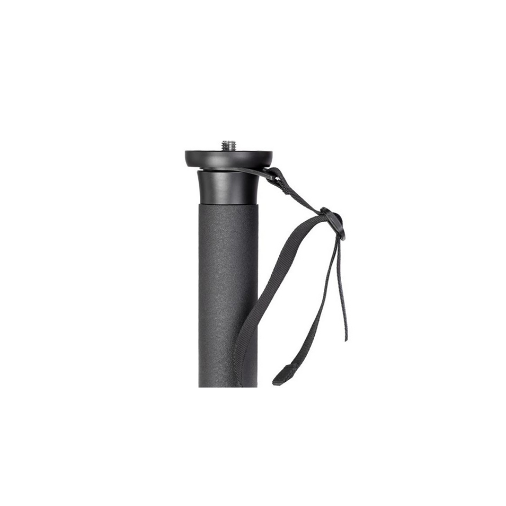 Close-up of a black tripod head with a screw mount and strap.