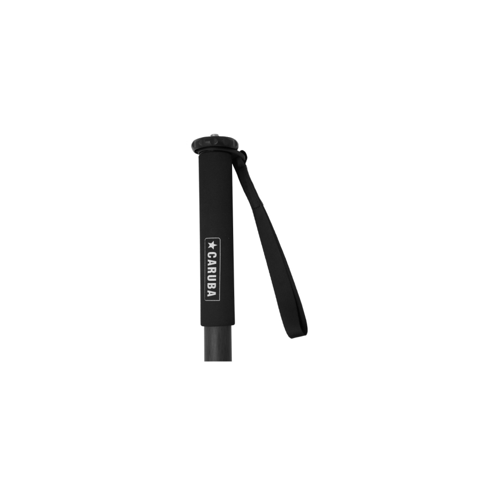 Black handle of a trekking pole with strap and CARUBA logo.