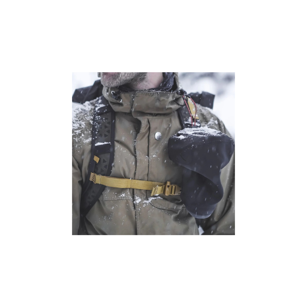Close-up of a person in winter gear with a camera cover.