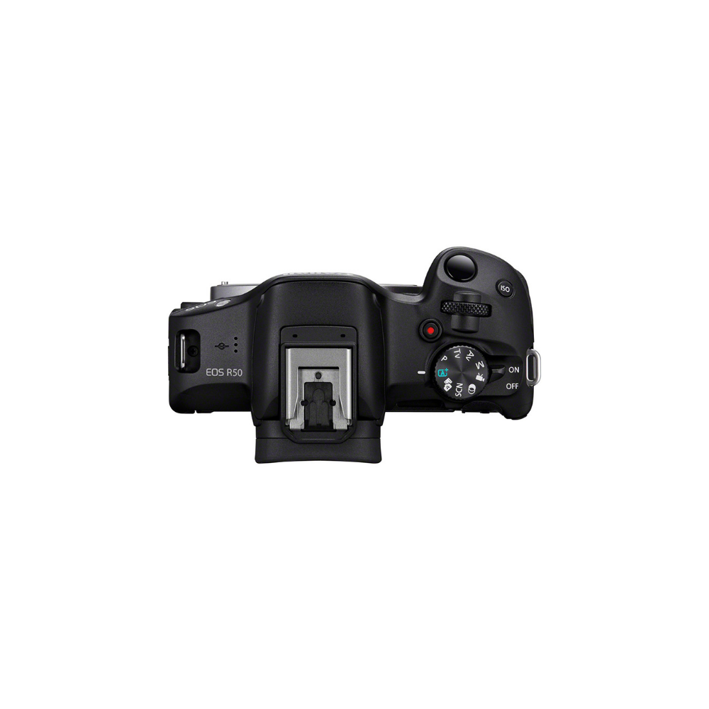 Top view of a black Canon EOS R50 camera with hot shoe and mode dial.