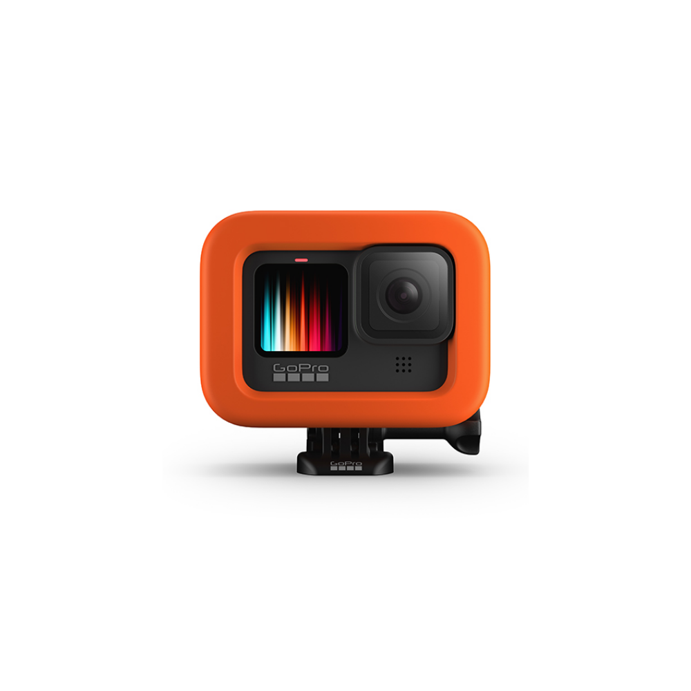 Pomarańczowa kamera GoPro z czarną obudową i kolorowym wyświetlaczem.