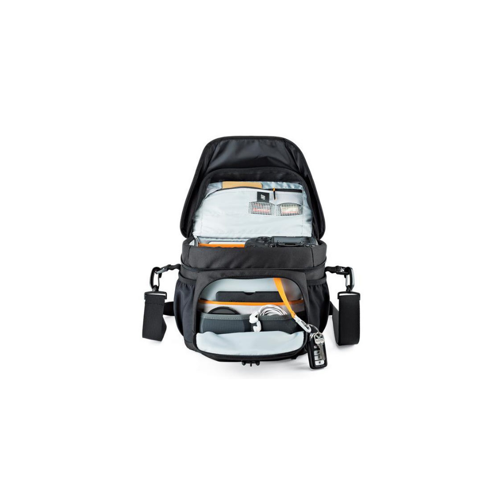 Black camera bag, open, with gear like camera, cables, and keys inside.