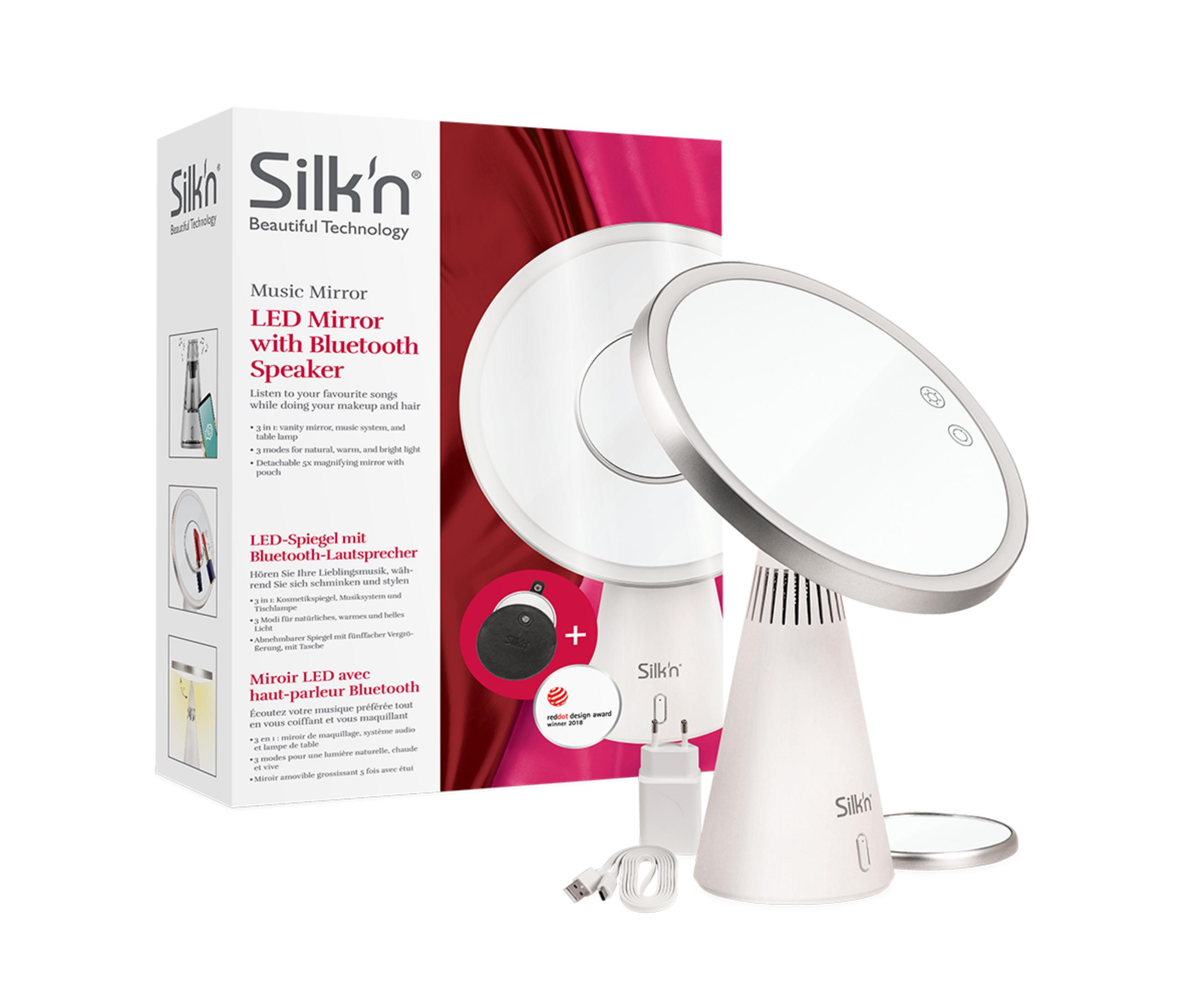 Ein weißer Silk'n LED-Musikspiegel mit Bluetooth-Lautsprecher und Zubehör.
