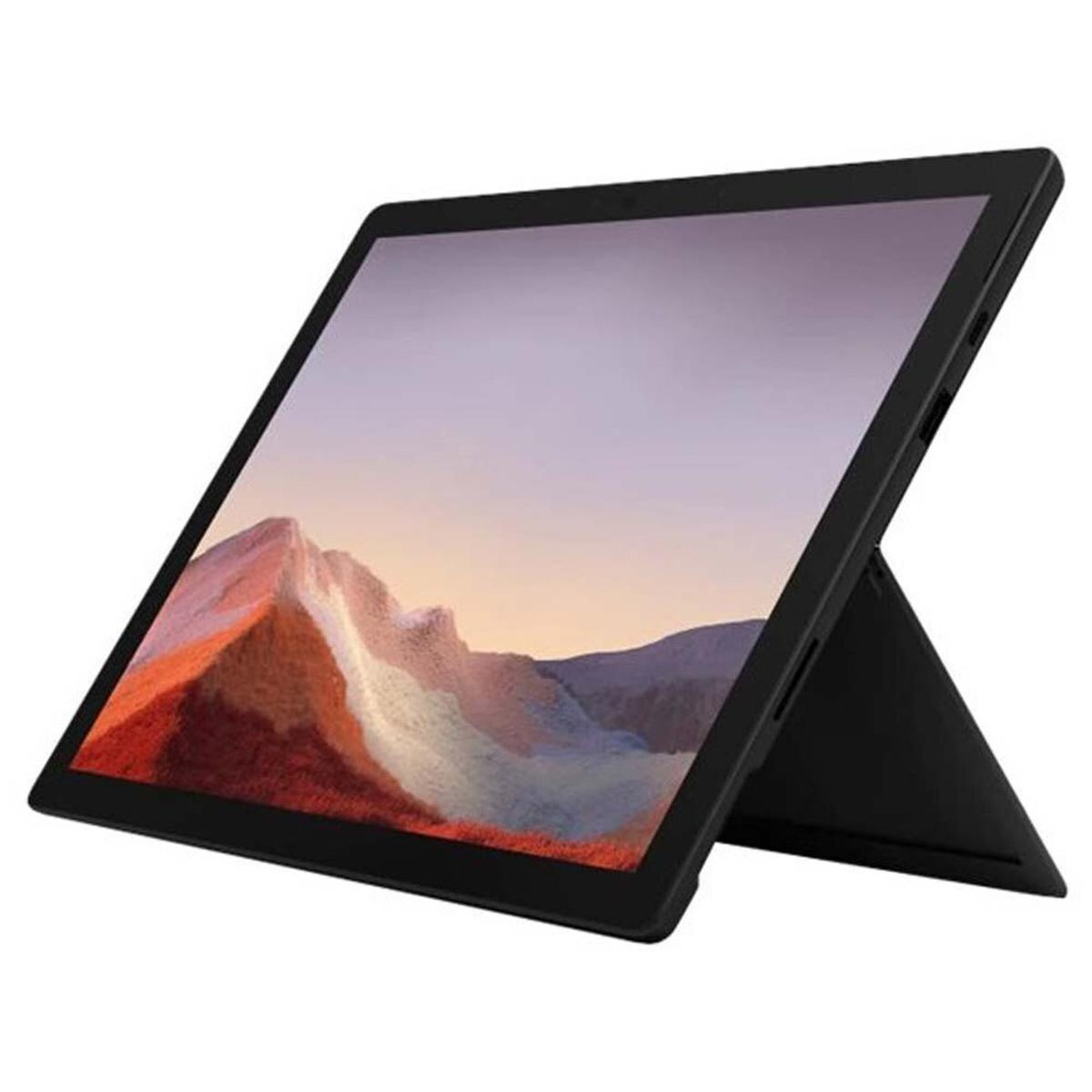 Tablet nero con supporto che mostra un'immagine di paesaggio montuoso.