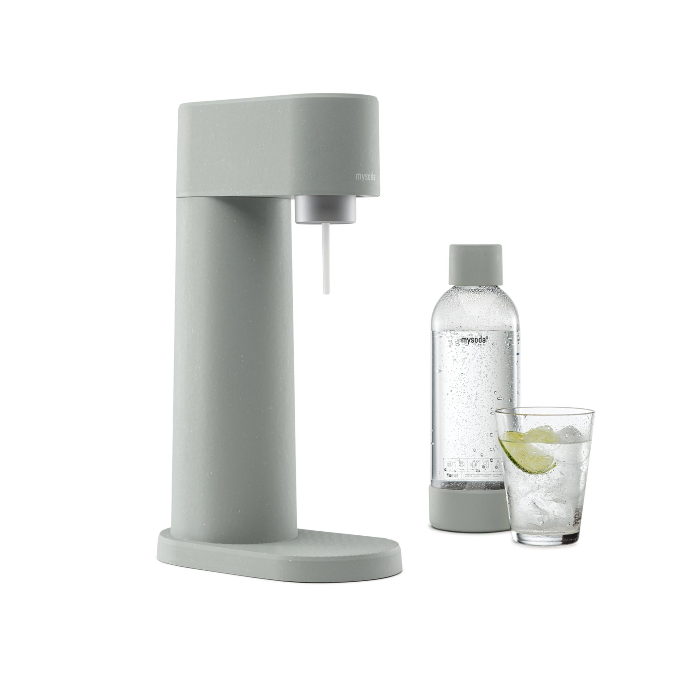 Gray soda maker with bottle and glass with ice and lime.