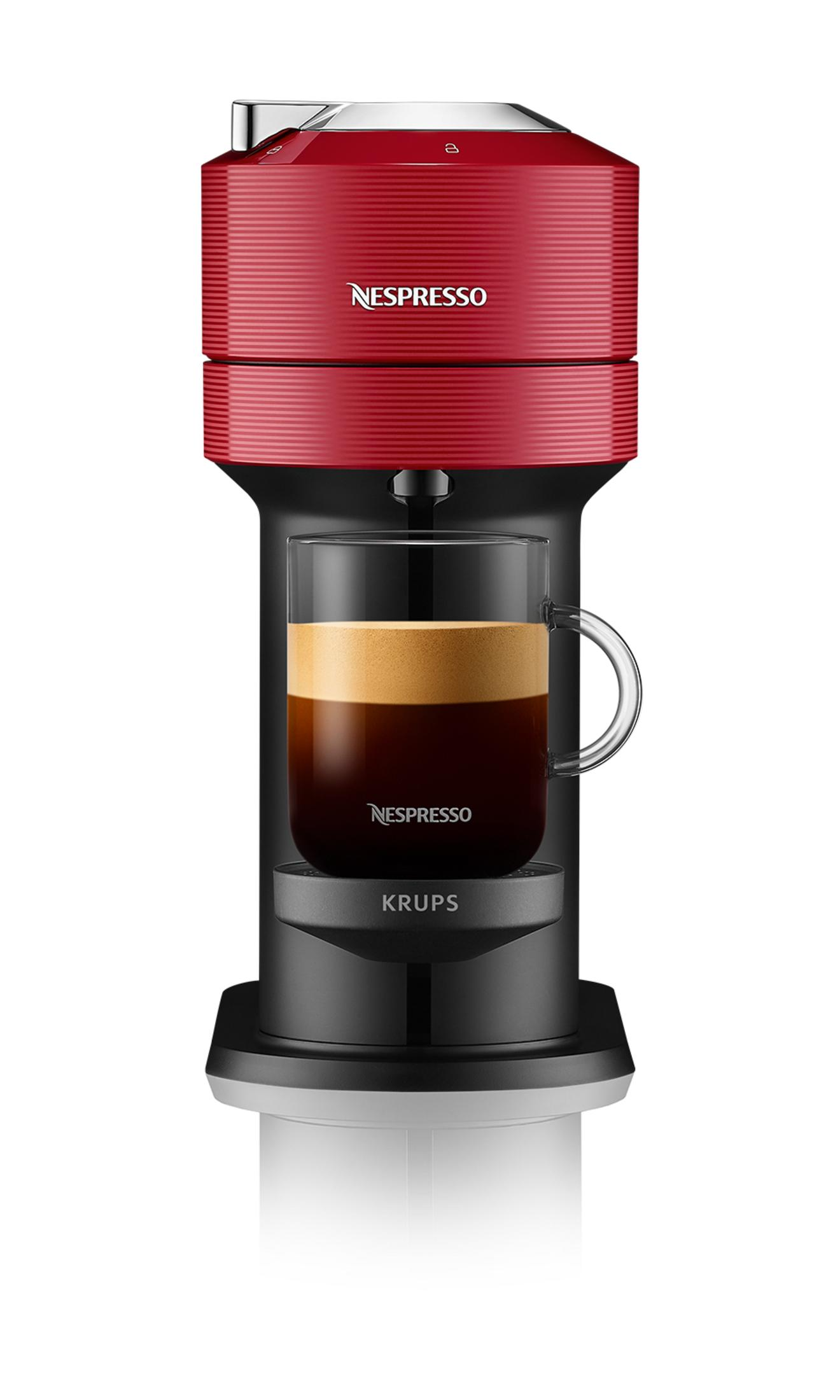 Una macchina da caffè Nespresso rossa che prepara una tazza di espresso.
