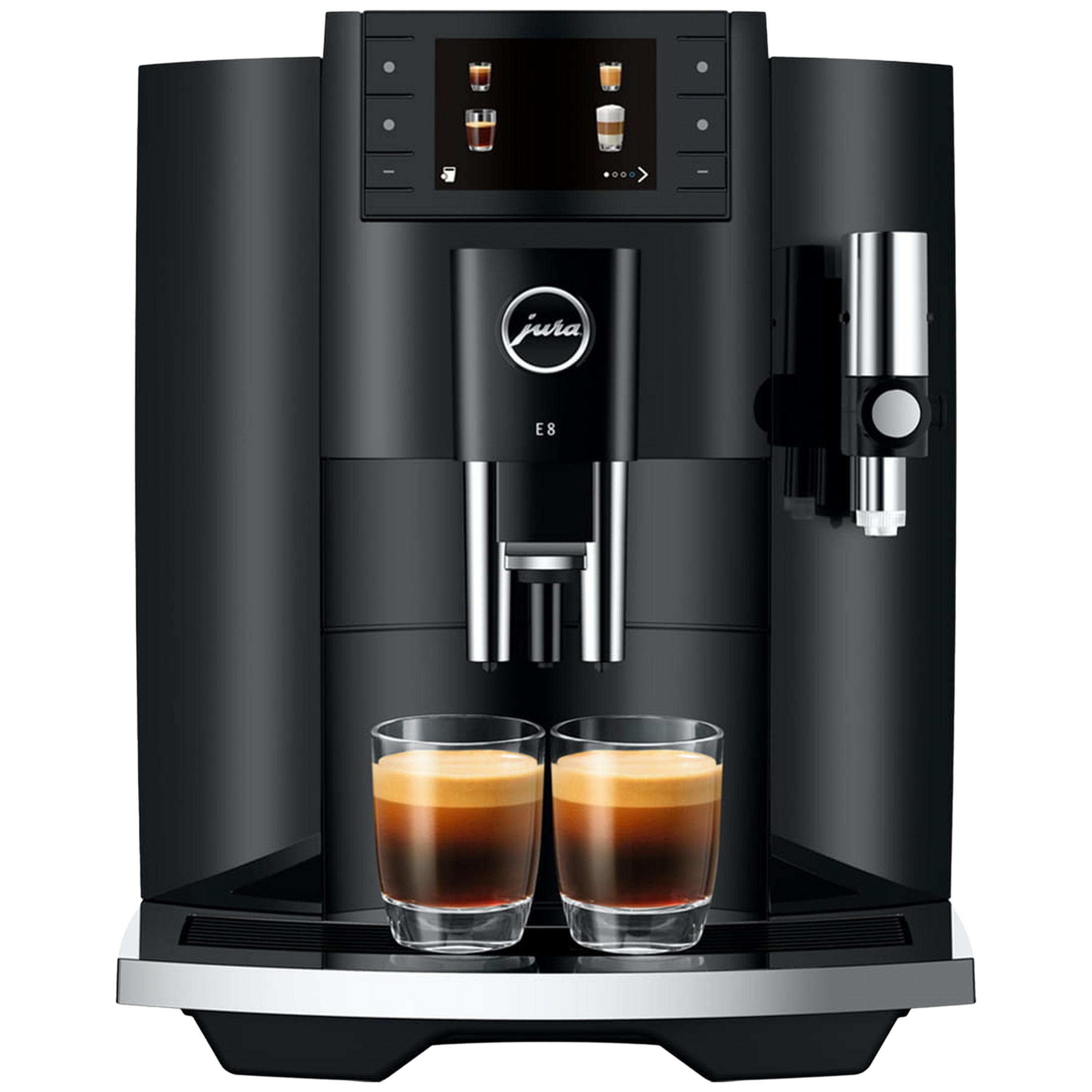 Macchina da caffè nera con due bicchieri di espresso e schiuma dorata.