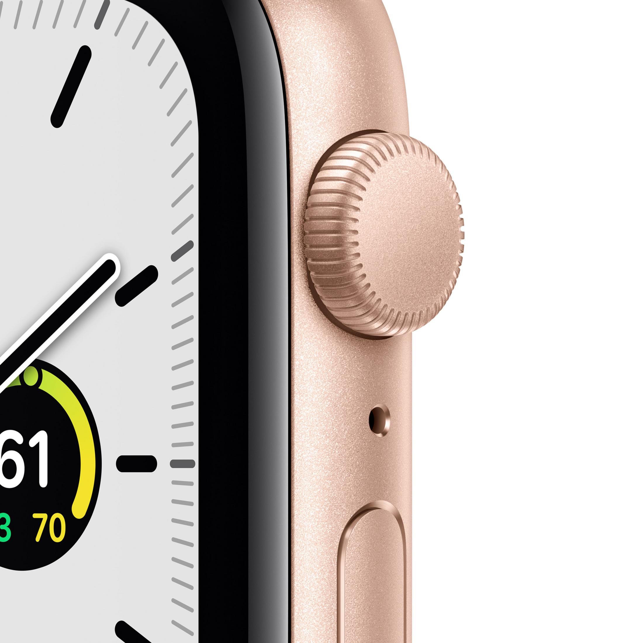 Primer plano de Apple Watch oro rosa, mostrando corona, pantalla con números y métricas.