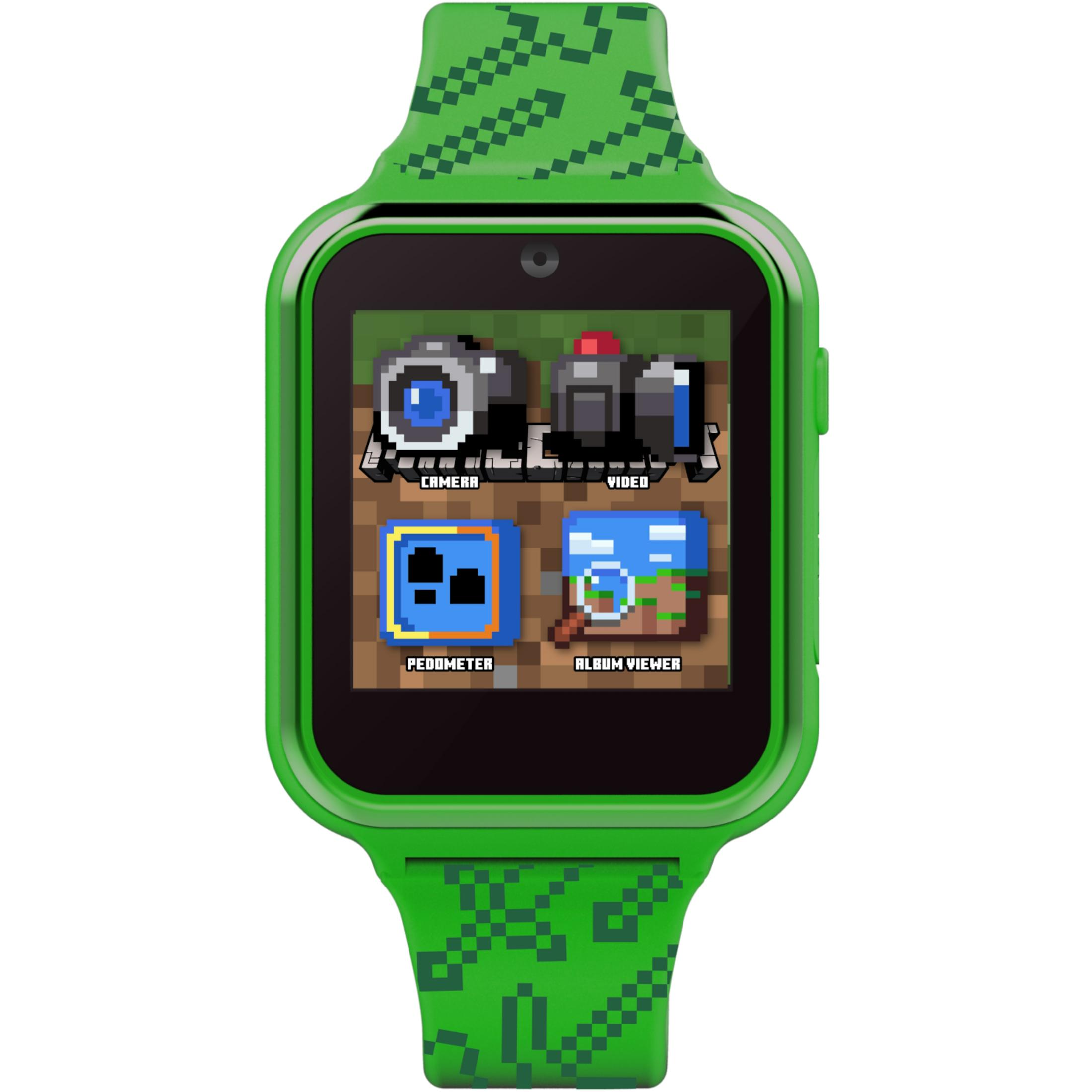 Uno smartwatch verde con grafica pixelata mostra icone per fotocamera, video, contapassi e visualizzatore album.