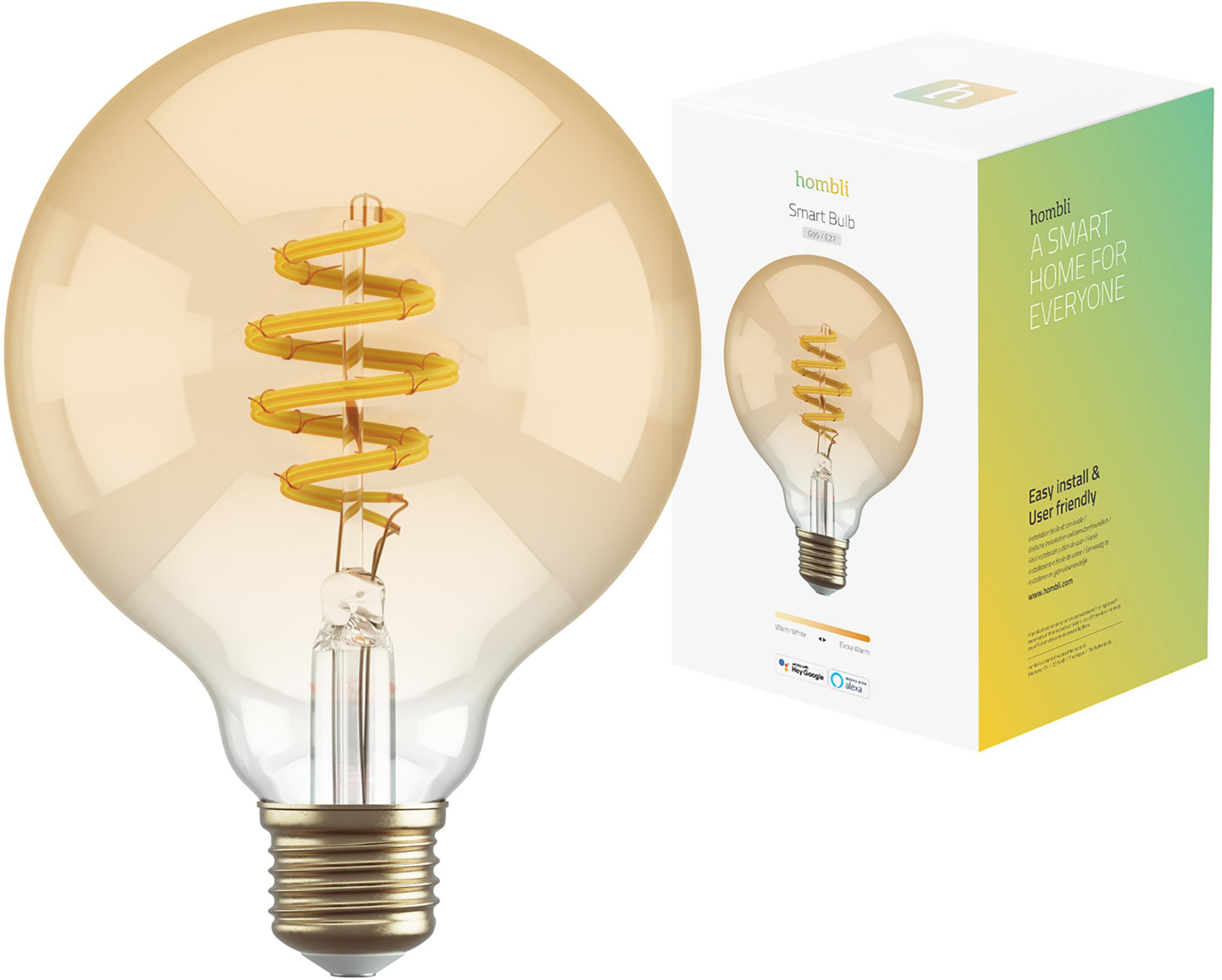 Une ampoule de couleur ambre avec un filament enroulé et une base dorée à côté d'une boîte.
