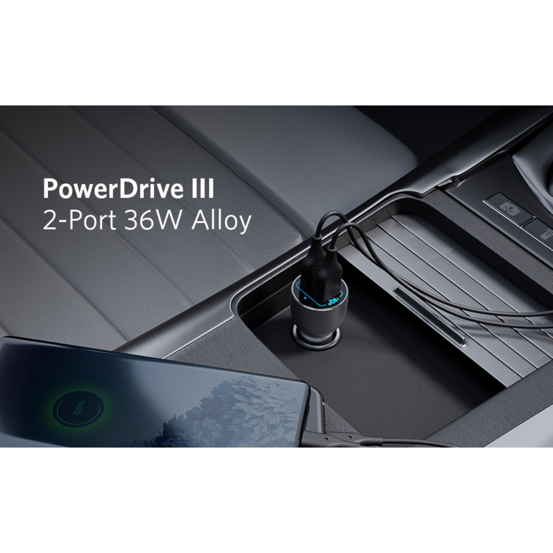 Un caricabatterie per auto nero con due porte USB, uno smartphone in carica.