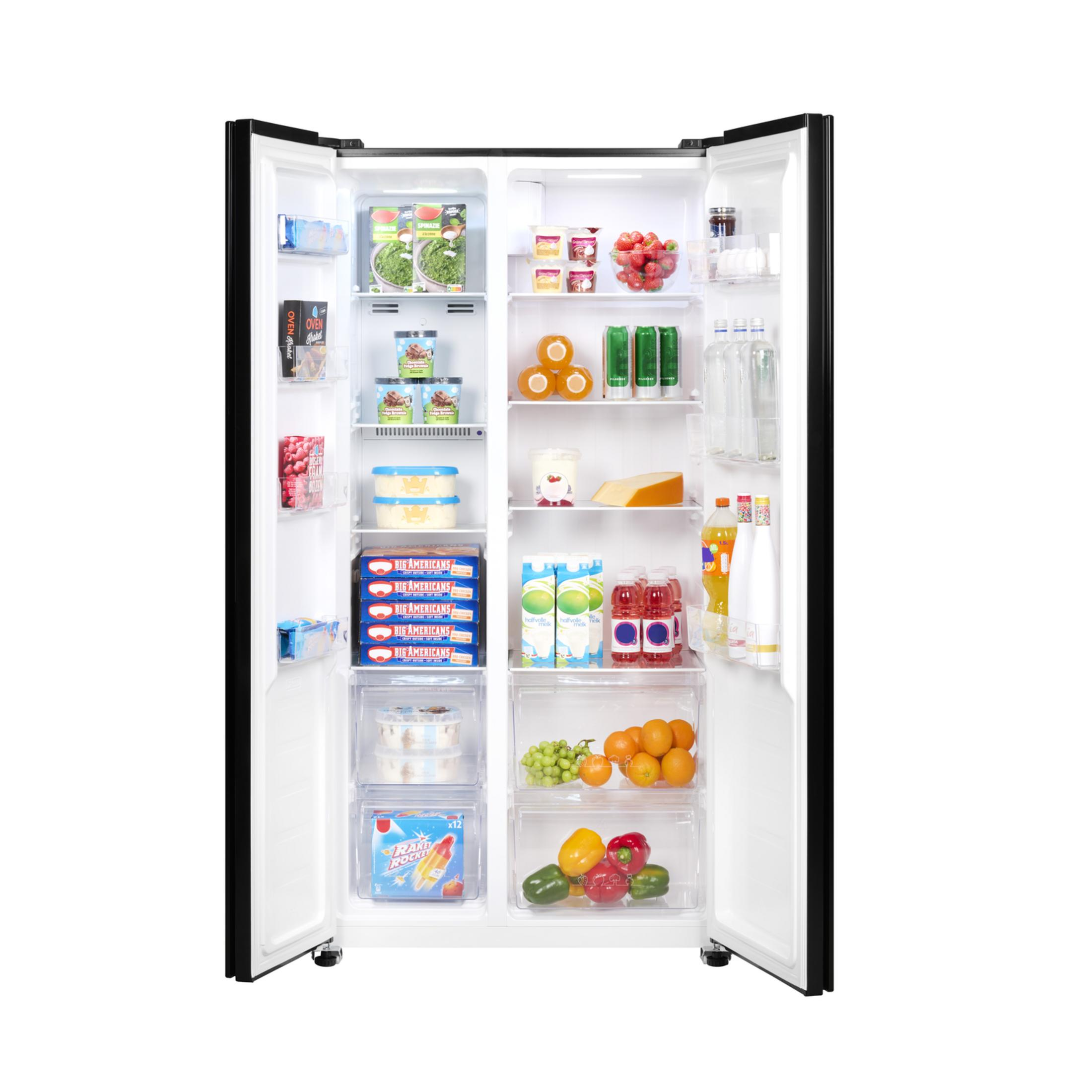 Open refrigerator filled with food items including ice cream, fruits, vegetables, and drinks.