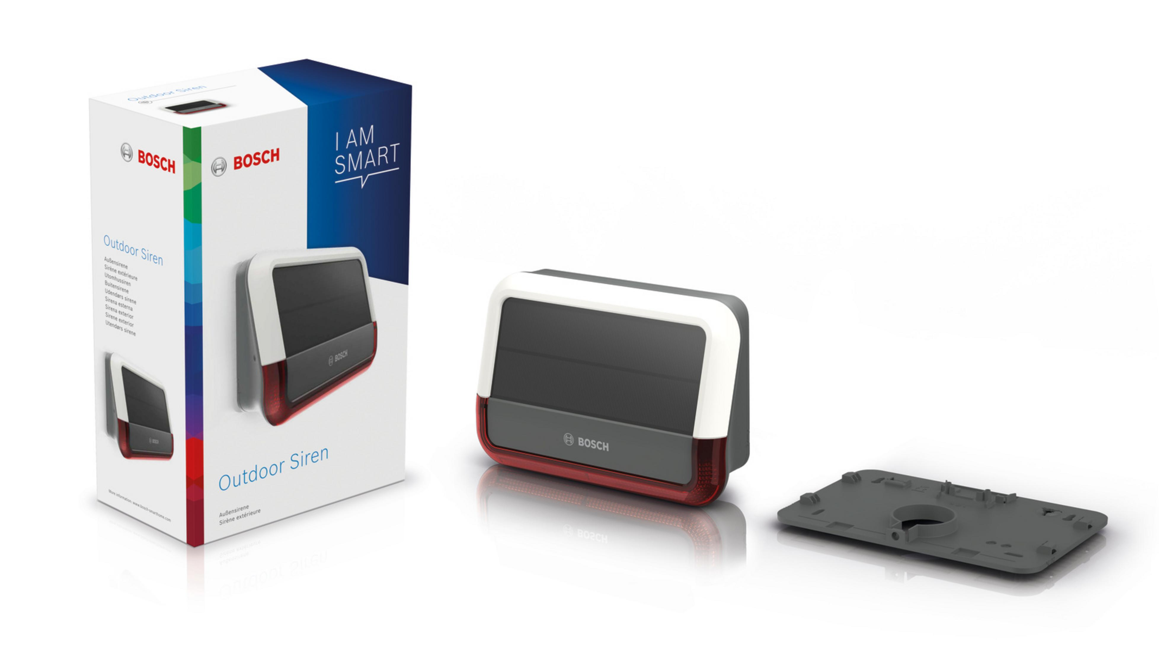 Ein Bosch Outdoor Siren Paket mit Sirene, Verpackung und Montageplatte.