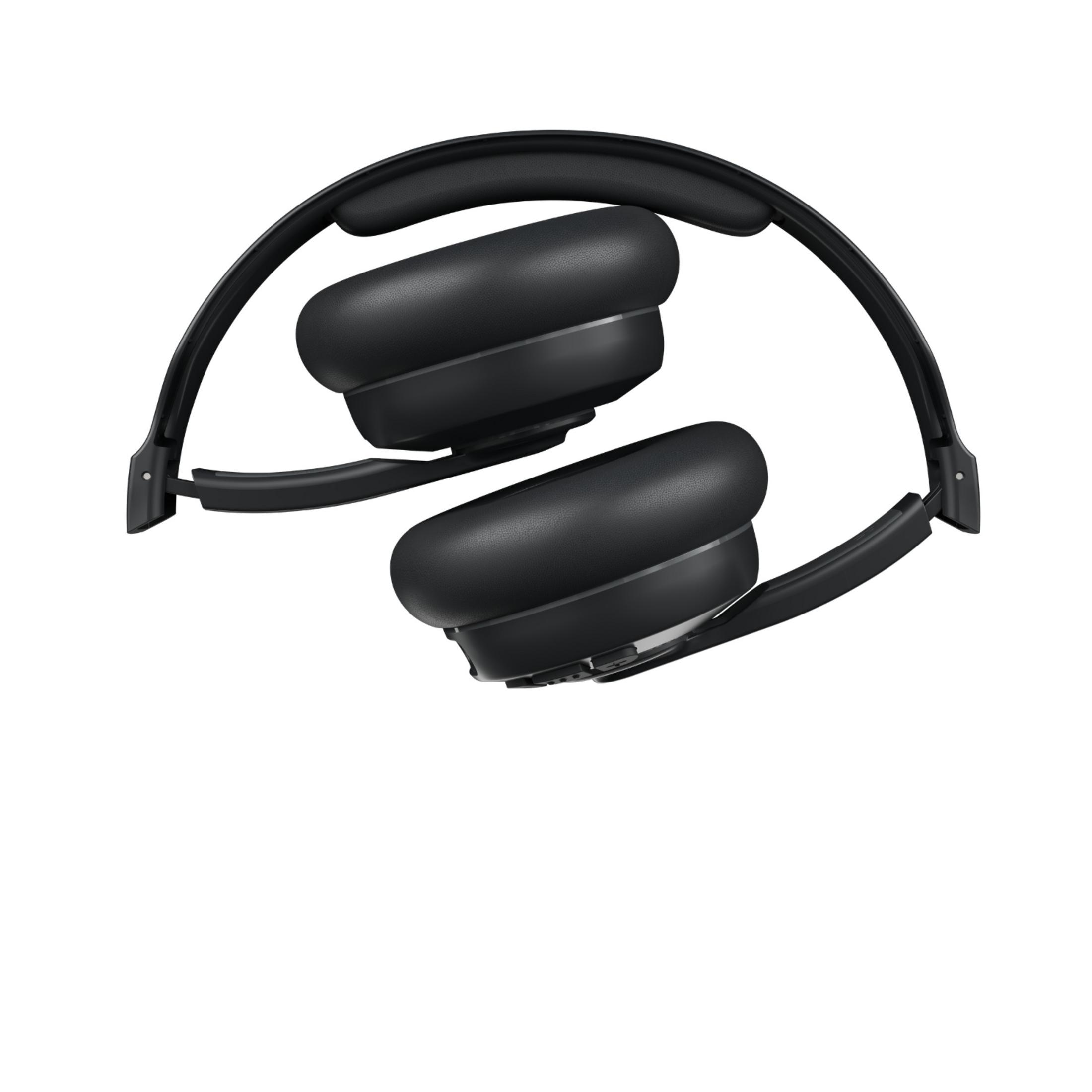 Casque circum-auriculaire noir plié sur fond blanc.