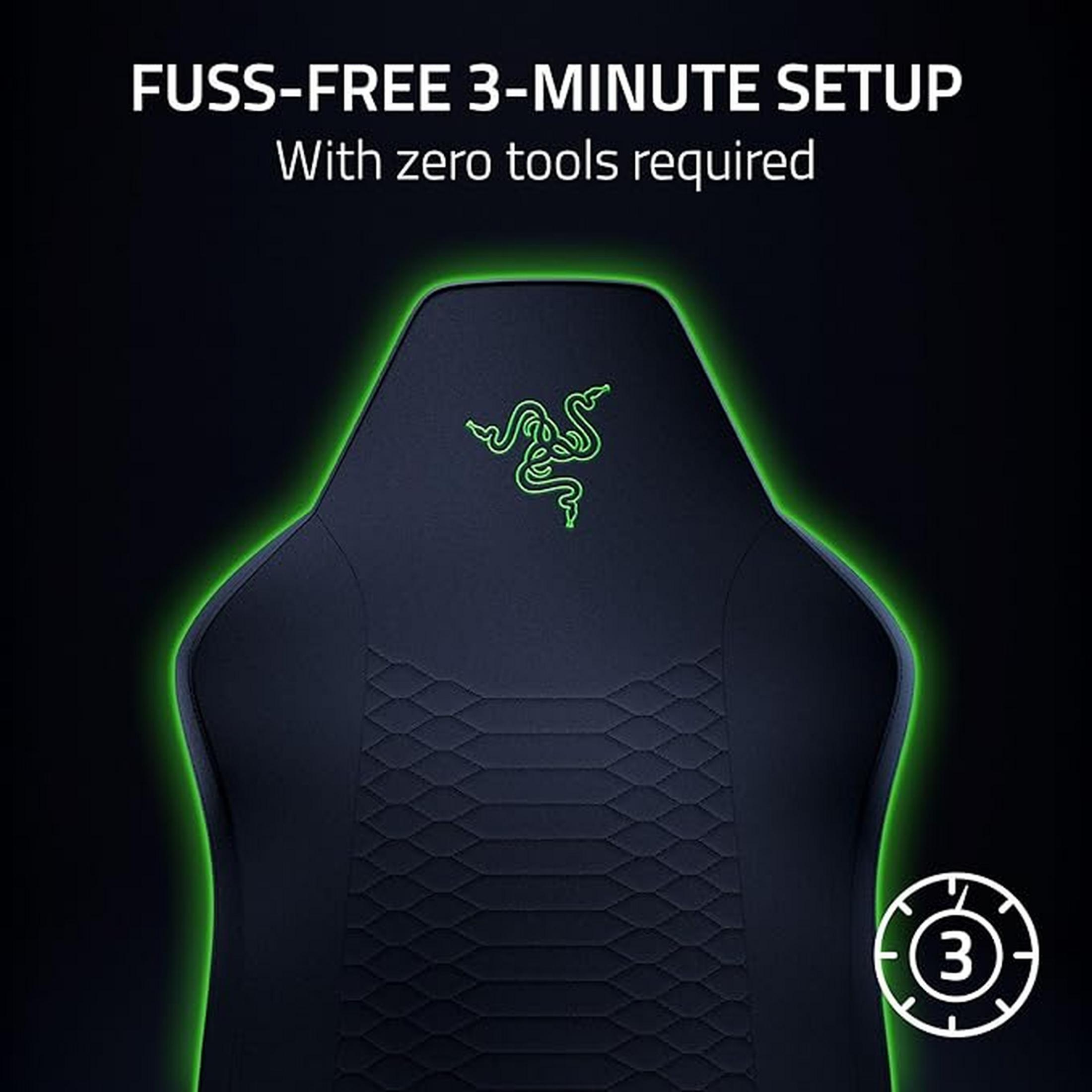Ein schwarzer Gaming-Stuhl mit Razer-Logo und grüner Umrandung. 3-Minuten-Setup.