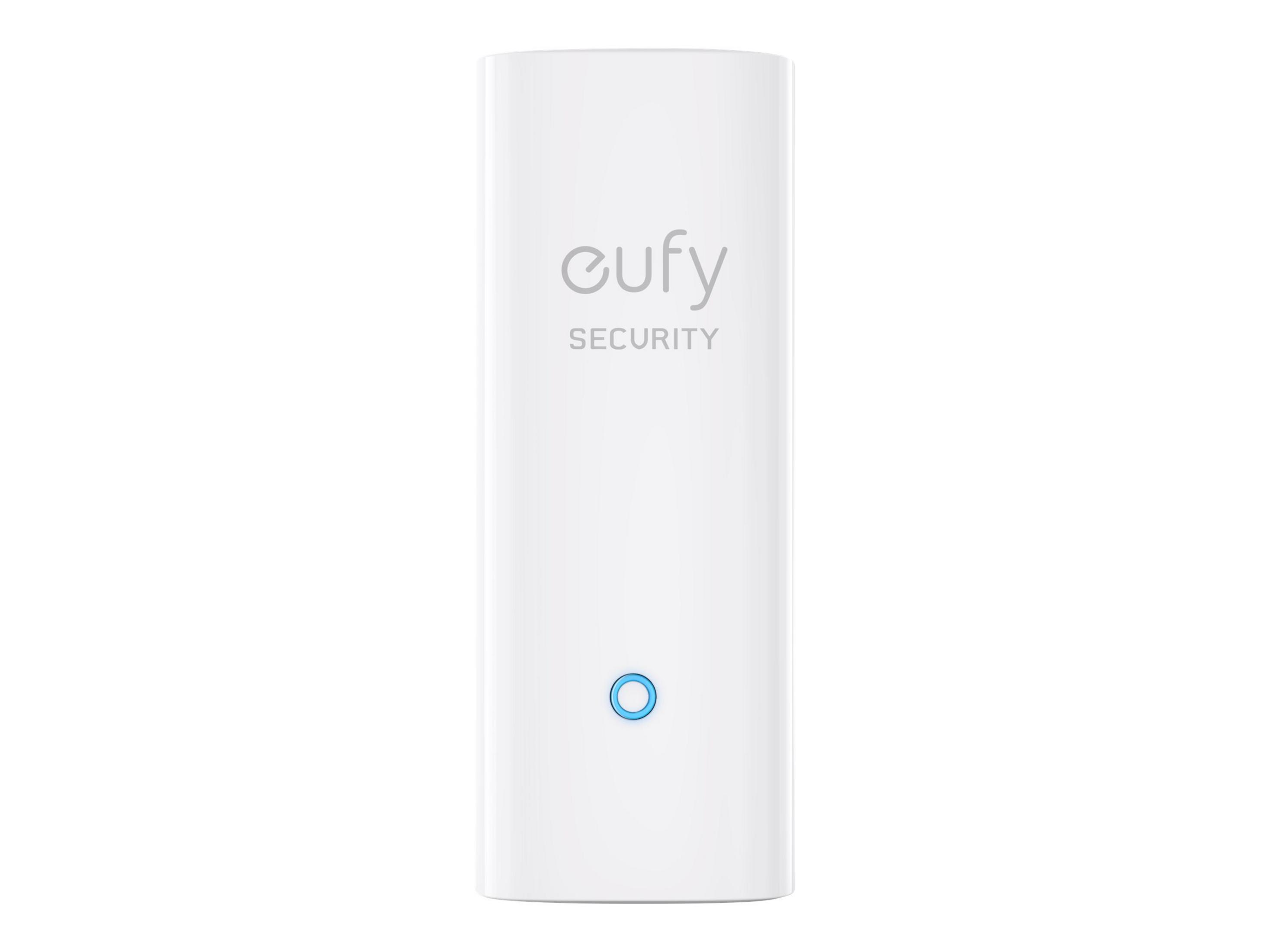 Ein weißes eufy SECURITY Gerät mit einem blauen Kreislicht.