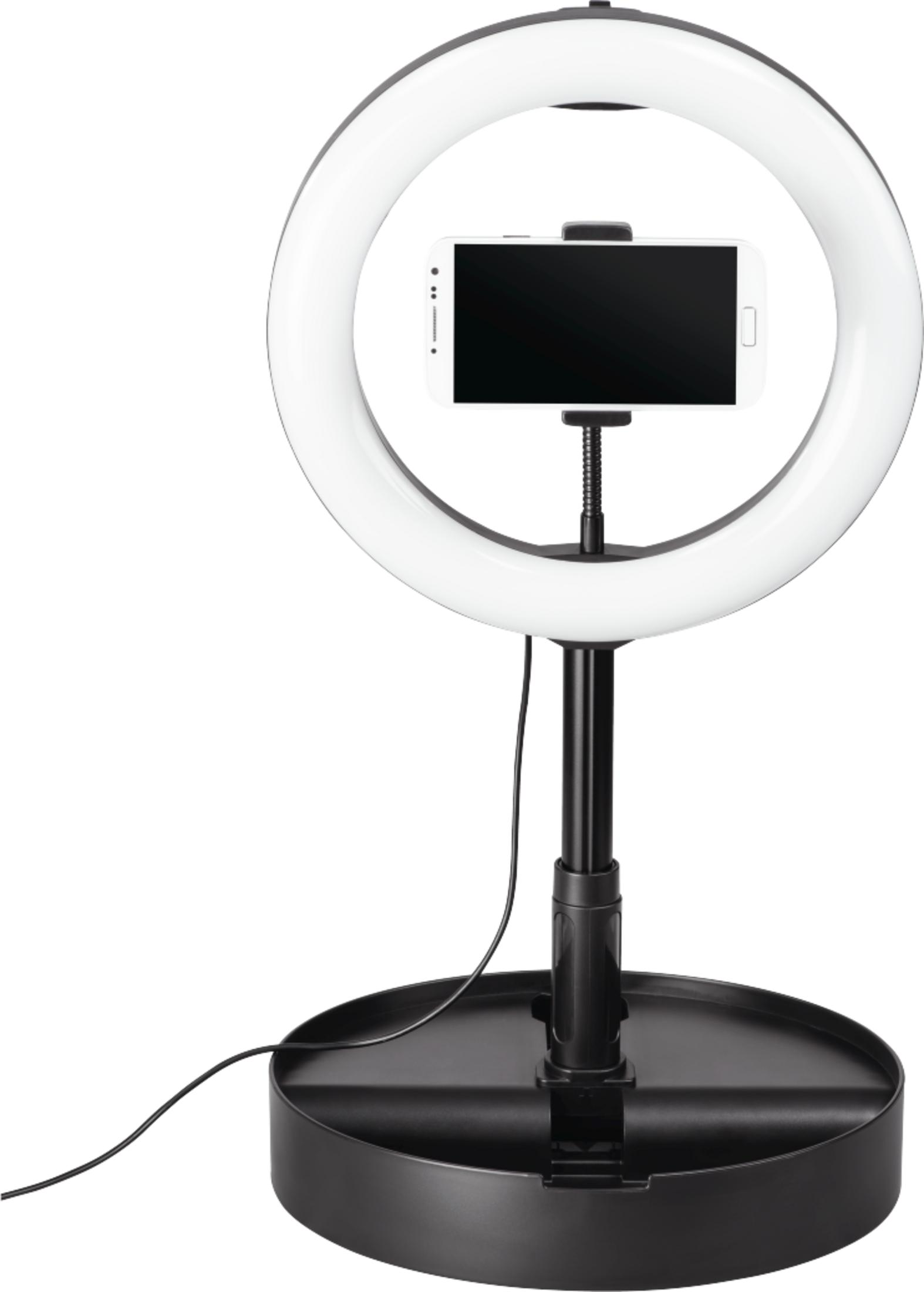 Lampa pierścieniowa ze uchwytem na smartfona pośrodku na czarnej podstawie.